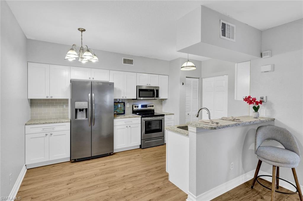 BEST VALUE ONE BEDROOM CONDO ON THE MARKET! LOCATION, LOCATION, BEAUTIFULLY UPDATED, AFFORDABLY PRICED (With the LOWEST CONDO FEES OF SIMILARLY PRICED HOMES), FIRST FLOOR, PET-FRIENDLY Condo in the Gardens at Bonita Springs, nestled just South of the intersection of West Terry St. and Matheson Ave. This MOVE-IN READY condo has many upgrades including the KITCHEN AND BATHROOM, NEW CEILING FANS, NEW HVAC (AUG 2020), NEW WATER HEATER (JAN 2026), NEW DISHWASHER (JAN 2022), NEW WASHING MACHINE (JULY 2023). Luxury plank vinyl flooring throughout. Very large bedroom with huge WALK-IN CLOSET. Beautiful greenspace and gopher tortoise preserve area. The convenience of first floor with assigned parking right in front of the walkway is a bonus. Plenty of guest parking! Beautifully maintained grounds, this association is professionally managed by some of the best in the area! LOW CONDO FEES at only $224.64/month (a 65 cent increase from last year!) Enjoy the Resort-style pool and Fitness Room plus a shaded area with picnic tables and grills for dining al'fresco! Enjoy Monday nights in the clubhouse for a game of cards from 5pm-8pm. First-time home buyers, Snowbirds and year-round residents love to call the Gardens at Bonita Springs HOME! This condo is also ideal for business travelers who need a convenient crash pad or for FGCU or local college students for a quiet environment to study. A short distance to Downtown Bonita Springs where you will find a BEAUTIFUL PUBLIC LIBRARY, SUGAR SHACK, RIVERSIDE PARK, ROOFTOP AT RIVERSIDE, KAYAKING, BONITA WONDER GARDENS, HISTORICAL SITES & COTTAGES, RESTAURANTS and so much more! You will love the proximity to the "soon-to-open" new MIDTOWN BONITA just a few miles to the East. The Old US 41 coridor is growing in leaps and bounds and has become the new favorite hot spot for holiday events, nightly live music, and recreation with a flare of Olde Florida ambiance. Conveniently location between Naples, with only 8 miles to SEED TO TABLE, and Fort Myers with only 23 miles to REGIONAL SOUTHWEST FLORIDA INTERNATIONAL AIRPORT. Many Gulf of America Beach options to choose from including Naples, Bonita Beach, to Lovers Key, all a short drive away. ***ONE YEAR HOME-TECH HOME WARRANTY INCLUDED WITH PURCHASE!***Quick move-in available! (Preferred X500 Flood Zone. No prior storm damage.)