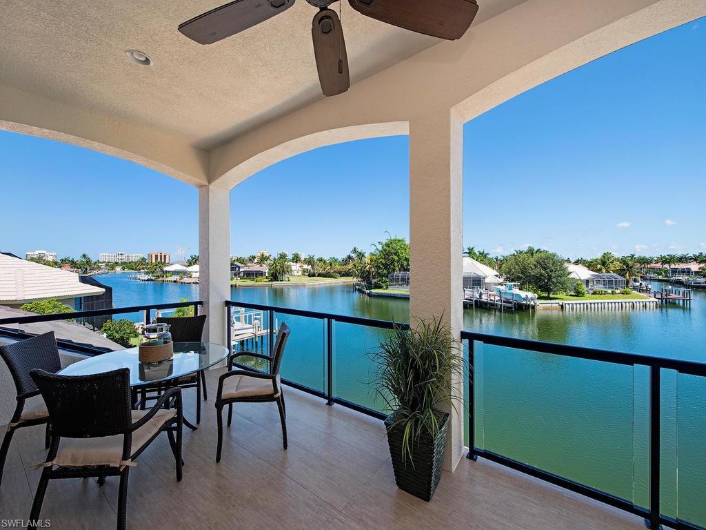 H.12840 - Converging waterway views from this fabulous 4000 sq ft home. Custom built cabinetry throughout, quartz counters, luxurious master bath w/rain shower, custom master closet, hardwood flooring in main living area, second floor has 3 bedrooms, 2 baths & family room, a large balcony w/custom mahogany doors offering gorgeous water and sunset views! Customized ceilings featured throughout the home.