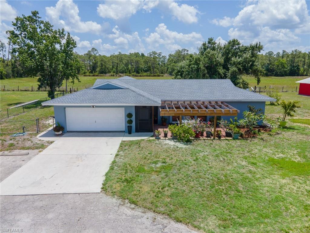 Here is the perfect size equestrian estate on nearly 5 acres, fully fenced and cross-fenced.  Agricultural tax exemption in place and located outside of a flood zone.  
This 3BR/2BA concrete block home features an open floor plan with many modern updates including a new hot water heater (March 2026), roof (July 2024), two newer A/C units (2022 & 2023), new well pump (2022), and updated water softener equipment. Screened back lanai is wired for a hot tub and offers ample space for outdoor dining. Existing dog pool can be removed, leaving room to add an in-ground pool with enclosure. The property is designed for equestrian use with lush pasture (seasonal photos shown), mature oak trees for shade, and three pastures each with lean-tos. The 74’ x 36’ main barn includes 7 (12x12) stalls plus a feed stall (potential 8th), all equipped with rubber mats, automatic waterers, and fans. Air-conditioned 12x12 tack room, wash rack with overhead boom hose, and washer in barn for added convenience. Enclosed animal area suitable for chickens, rabbits, or other small livestock.  There is an additional 24’ x 24’ barn with run-out stalls. A 70’ x 100’ riding arena and a round pen (included). Over 11 water spigots throughout the property. Majority of fencing is durable ram fencing.  Ideal for private use or income-producing opportunities including boarding, training, or lessons. Fully fenced and gated for privacy, set back from main roads.  Also, conveniently located near veterinary services, shopping, dining, healthcare, fitness, parks, marina access, and multiple boat launches. Easy access to I-75.
This is a functional, well-equipped equestrian property offering both comfort and versatility.