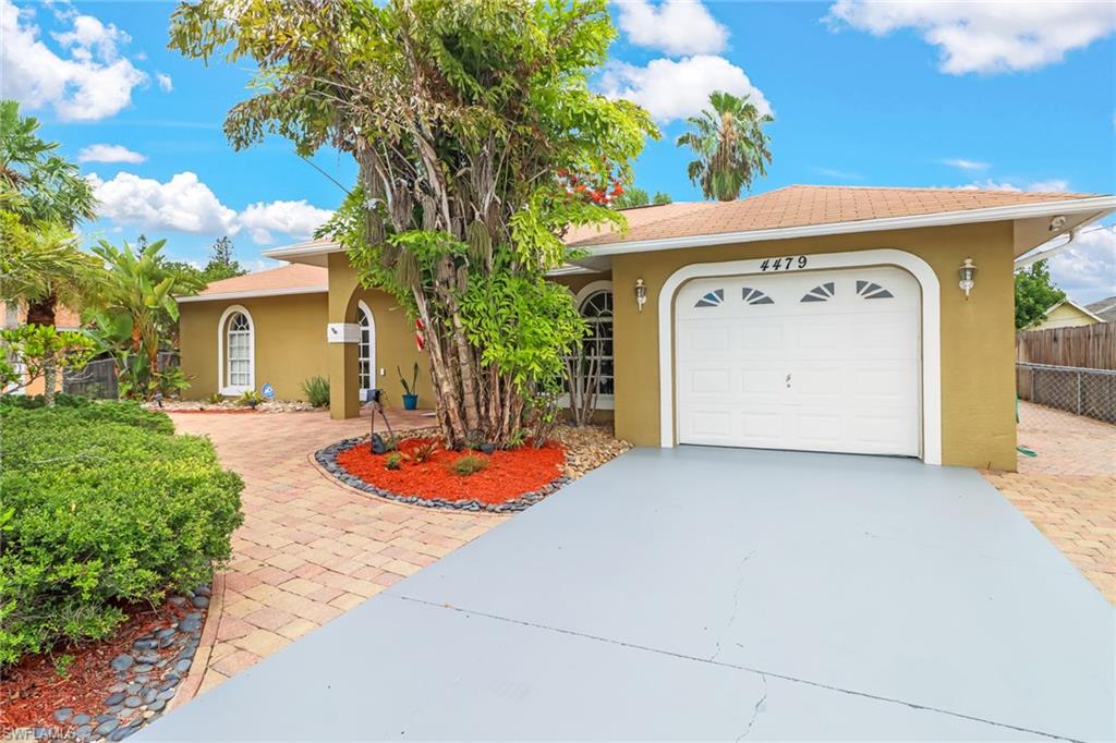 New to market in the prime location of Golden Gate City! This stunning 3 bedroom plus den 2 bathroom single family home is situated on a beautiful lot ; featuring a new shingle roof, fresh interior & exterior paint, stainless steel appliances throughout the kitchen, and wide tile throughout. Upon arrival, you will notice your private and paved crescent driveway bordered by mature and vibrant landscaping, allowing additional space for gatherings of any size! As you enter you'll notice the spacious floor plan and vaulted ceilings that allow in plenty of natural light. Access and indulge in your private and vast backyard via the dining or master bedroom. Privacy isn't the only benefit of your backyard! This space offers plenty of potential to completely landscape and design into the perfect and spacious backyard oasis!