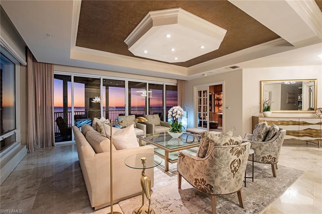 Experience the epitome of Park Shore beachfront lifestyle. Le Jardin's design offers unique privacy from the moment you enter your garage and step into your residence. This spacious, luxurious home has window walls of glass inviting an abundance of south-side light while framing stunning views of the glistening gulf, Venetian Bay and city vistas. The thoughtfully designed floor plan features a generously sized primary suite, separate living and family rooms, and two secluded guest rooms, along with two screened and shuttered lanais ideal for enjoying spectacular sunrises and sunsets. Offered fully move-in ready and turnkey furnished, the elegant interior design seamlessly blends timeless style with contemporary sophistication. Le Jardin, The Garden, is a top-tier boutique beach building with only 52 residences. Resort-style amenities are inclusive of a beachfront pool and spa, outdoor grill area, fitness center with sauna and steam rooms, club room, tennis court, three guest suites and 24-hour security.