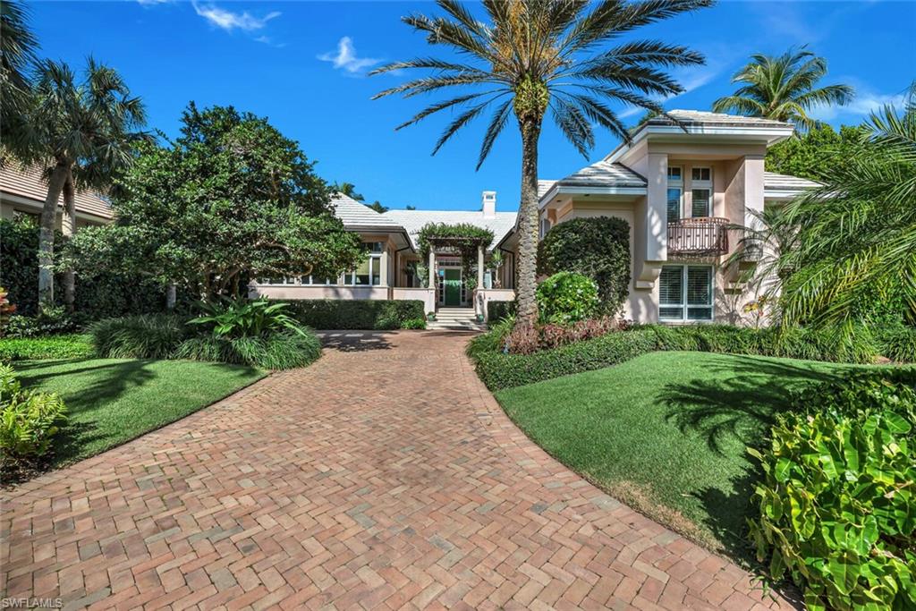 H5823 - Rarely available home in the gated enclave of Little Harbour.  Western exposure with tranquil lake views and mature landscaping. Home offers 4 bedrooms, 4 bathrooms, formal living room with working wood burning fireplace, formal dining room, large master suite with his and her baths, home study with beautiful built-ins, morning room, wet bar, large pool with covered spa, huge screened covered patio to enjoy the outside. Ideally located in the heart of Olde Naples, Little Harbour offers it residences 9 boat docks to lease at $72 per foot per year ranging in size from 20-45 feet. This property is Port Royal Club Associate Membership eligible.