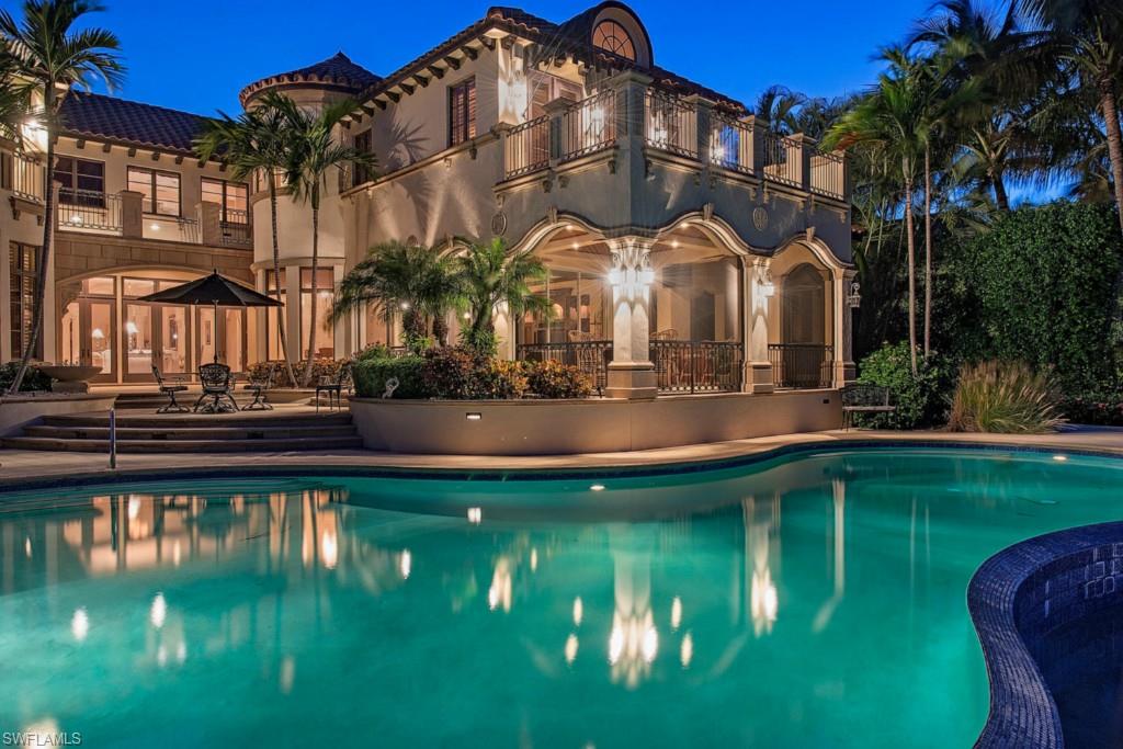 H.7527 -  This Port Royal bay front home is without equal & clearly one of Port Royal's most elite luxury homes & is ideally situated with panoramic vistas along Naples Bay. Prepare to be blown away as you enter this architectural masterpiece through the magnificent gated entranceway, into the majestic grand foyer & see the lavish attention to detail throughout its 10,868 sq.ft. U/A. This 6 bedroom home plus guest living quarters boasts among its many features marble floors, custom stonework & millwork throughout, home theatre room, billiards room, beautiful tray ceilings, multiple expansive verandas and much more. Gourmet kitchen includes granite countertops, two islands, dual sinks, double ovens & has everything the gourmet chef would desire. The large pool area with spa, waterfall, outdoor lanai and summer kitchen & gorgeous bay vistas is the perfect outdoor entertainment spot. Dock with water, electric & two boat lifts. This home outshines all expectations & is a Port Royal Gem.