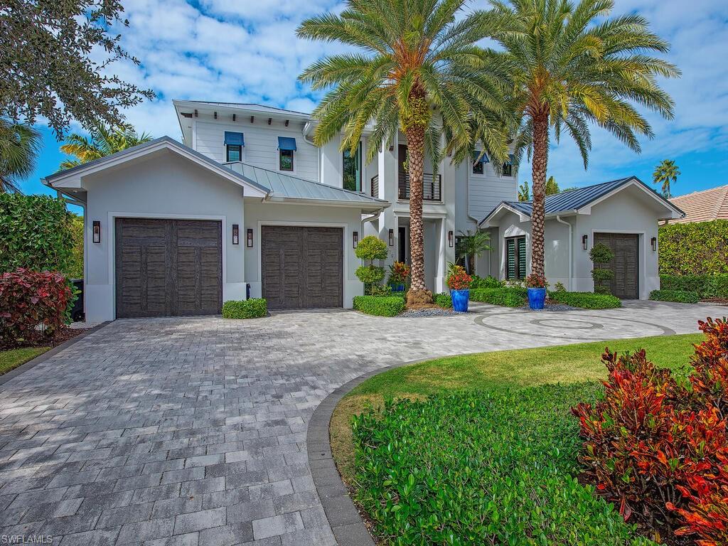 Impeccably maintained and located in the coveted Moorings neighborhood, this exceptional residence represents the pinnacle of luxury design and construction. An award-winning home recognized with five prestigious accolades, it was prominently showcased as the Signature Home by Home & Design Magazine. Positioned in the preferred X-flood zone, the property has remained high and dry through three major storms, offering both peace of mind and enduring value.
The gourmet kitchen serves as the heart of the home, seamlessly opening to the family and dining areas. It features custom cabinetry, Mom’s desk, a walk-in pantry, a temperature-controlled wine room, and top-of-the-line Wolf, Sub-Zero, and Asko appliances—perfectly suited for both everyday living and entertaining. Expansive disappearing glass sliders fully retract to reveal an exceptional indoor-outdoor lifestyle, leading to a spacious lanai with a fully equipped summer kitchen, pool bath, dining and living areas, an elevated sun deck, and a fire pit overlooking the shimmering pool and oversized, lushly landscaped backyard.
The expansive first-floor primary suite is a private retreat, offering dual custom closets, separate vanities and water closets, and a discreetly integrated laundry room for ultimate convenience. Also on the main level are a warm and inviting office, an elegant powder room, and a thoughtfully designed planning area.
Accessed by both stairs and elevator, the second level features three additional ensuite bedrooms and a generous living area complete with a coffee bar and a large balcony offering sweeping views of the pool and backyard—ideal for relaxation or hosting guests.
Residents enjoy quick access to the Moorings’ private beach park and the charm of a true community, all while being moments from the world-class shopping, dining, and cultural offerings of downtown Naples. Home Warranty Included.