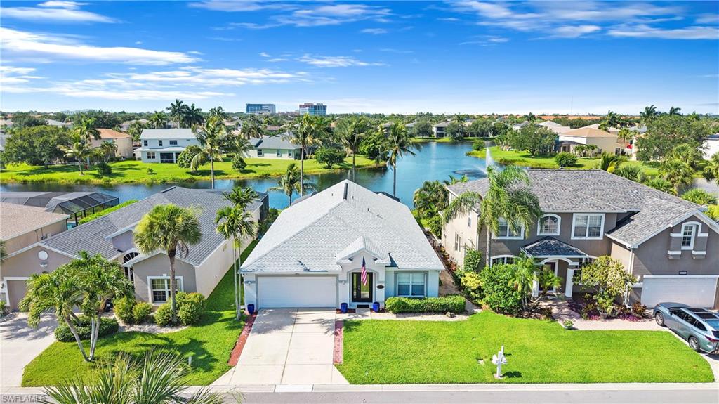 Set within the gated enclave of Gladiolus Preserve, this 4 bedroom, 2 bath residence occupies a deep lakefront lot where a manicured lawn extends to the water's edge. The newly updated panoramic screened lanai frames unobstructed lake views through premium No-See-Um screening and accommodates multiple al fresco dining areas, all softly lit by low-voltage lighting. A private heated pool, served by a new variable-speed pump and high-efficiency heater, anchors the outdoor living space.
The interior centers on a thoughtfully appointed chef's kitchen, where solid wood custom cabinetry surrounds a central peninsula with seating for 8 and 8 storage cabinets below. Top-tier appliances and a dedicated coffee and wine bar with built-in wine cooler elevate daily routines and entertaining alike. Adjacent, the gathering room offers an airy, light-filled setting finished with plantation shutters on double windows, decorative interior shutters, integrated ceiling speakers, and a discreetly tucked-away entertainment center.
Substantial recent improvements underscore the home's condition and preparedness. These include a new roof, high-impact hurricane windows, heavy-duty aluminum accordion storm shutters, a brand-new hot water heater, a generator-ready electric sub-panel, and a 5-camera security system that conveys. The home has no history of water intrusion, and a wind mitigation inspection dated April 2026 is available for review. Low-voltage lighting traces the driveway and walkways.
Beyond the gates, residents are within walking distance of Lee Health facilities, moments from shopping and dining, and a short drive from world-class beaches.