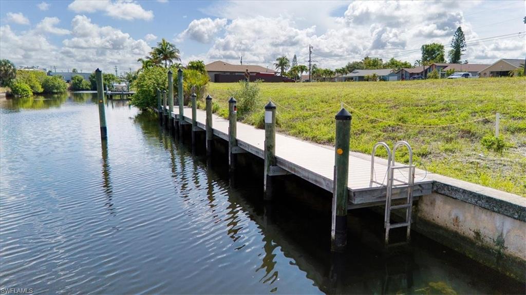 Build the Southwest Florida waterfront lifestyle you've been dreaming of! This exceptional 80' x 125' Gulf-access homesite is ideally situated on the highly sought-after Rubicon Canal, offering one bridge to open water and no locks for quick boating access. Whether you're planning sunset cruises, fishing adventures, or weekends exploring the Gulf, this location puts it all within easy reach.

A standout feature is the new 405± sq. ft. dock with pilings already installed for a future boat lift, saving you significant time and expense while giving you a head start on your dream waterfront retreat. All city utility assessments have been paid, adding even more value and peace of mind.

Surrounded by beautiful waterfront homes in an established neighborhood, this oversized homesite provides the perfect canvas to design the custom home you've always envisioned. Bring your builder, bring your boat, and start living the Florida lifestyle you've worked for.

Opportunities like this are becoming increasingly rare. Secure your piece of paradise before someone else does!

Highlights:

Gulf Access
One Bridge to the River
No Locks
Highly Desirable Rubicon Canal
80' x 125' Homesite
New 405± Sq. Ft. Dock
Pilings Installed for Future Boat Lift
All Assessments Paid
Ready for Your Custom Waterfront Home