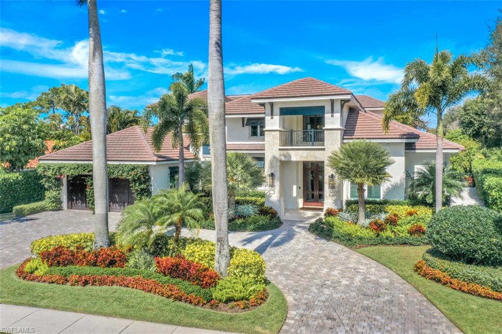 H4816 You have arrived. Luxury living at its best in the sought after neighborhood of Park Shore. Enter into the grand foyer with soaring ceilings and open floor plan.  The gourmet kitchen will please the most discerning chef with Viking gas stove, microwave and large center island.  The posh master suite is sure to please with sitting area , marble bathroom, jetted tub, heated tile bar, 2 vanities, water closet.  Spacious family room with 15 ft ceilings open to lanai featuring gas fireplace, outdoor kitchen, with refrigerator, grill and sink.  
Resort like pool and spa complete with waterfall, sound system and ambient lighting.  Freshly painted interior and new designer lighting, black diamond security system,  have all been recently added to this gorgeous home.