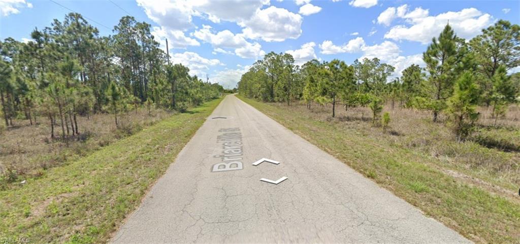 commercial lot on major road of 82, many exposures, close to everything, as-is