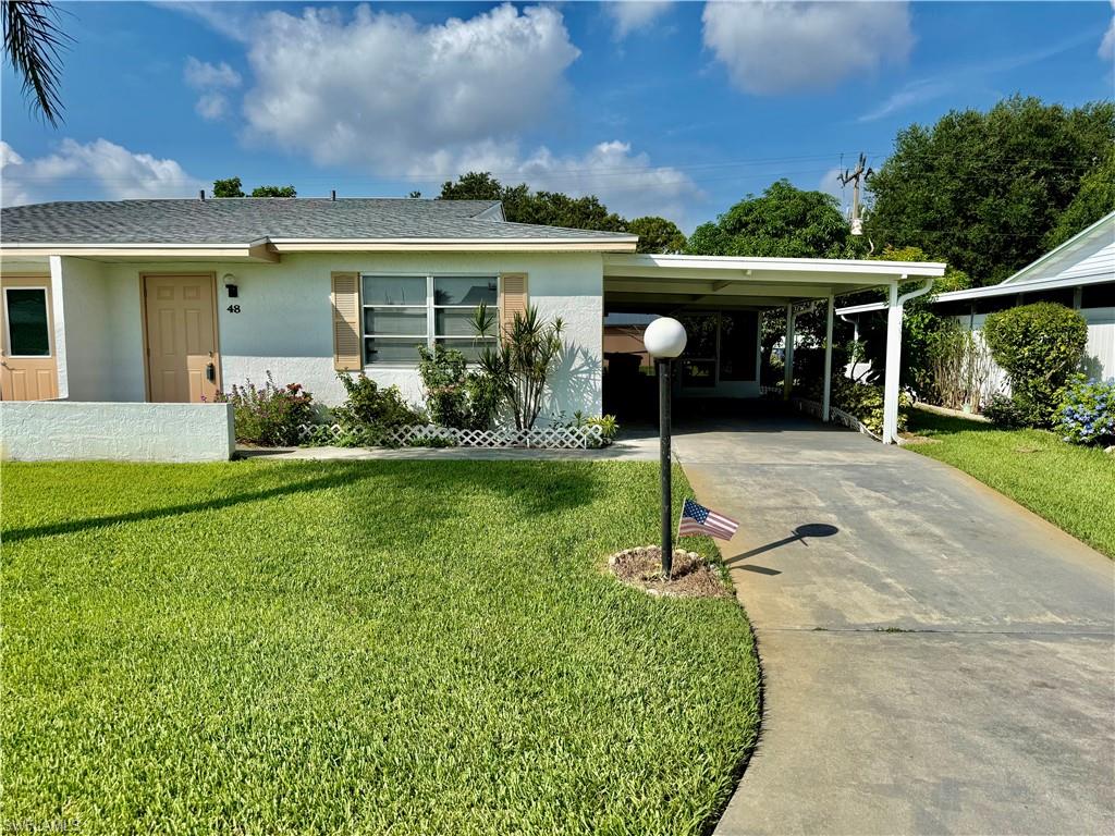 2 bedroom 2 bath Pinewood Condo located in the latest phase of Pinewood built in 1982 with STUCCO on the exterior and tiled tub and shower areas, 12 X12 screened lanai plus covered carport area with parking for 2+ cars, private setting in the rear of the screened lanai, ceramic tile floors throughout, eat in kitchen, walk in closet in guest bedroom, NEW WATER HEATER IN 2019, Rheem central heat and air new in 2015, quiet low traffic street, excellent location within walking distance to stores etc. on Homestead Rd and just minutes to SR 82, I-75, Ft Myers and the SWFL International Airport, 55+ community, pets OK. NO FLOOD INSURANCE REQUIRED. LEHIGH IS THE HIGHEST ELEVATION IN LEE COUNTY.