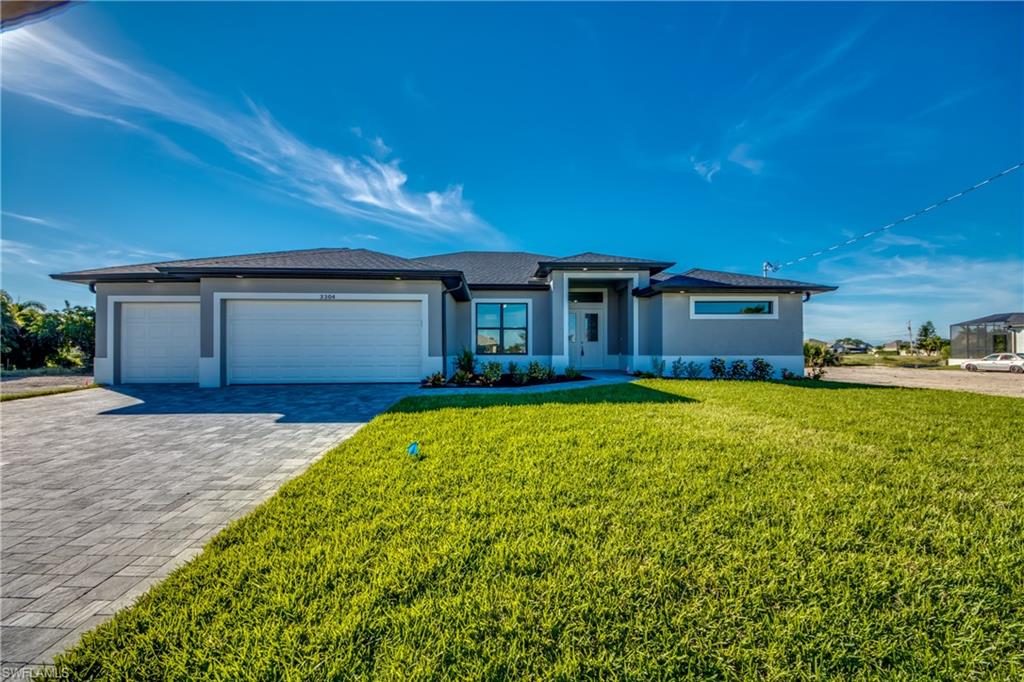 GULF ACCESS WATERFRONT HOME, READY TO MOVE IN TO".  Intersecting canal. Southern rear exposure. Tile floors throughout. Granite countertops.Plenty of kitchen cabinets with a pantry. Laundry room right off the kitchen.
Master bath has a huge shower and dual sinks and counters. 
Three car garage plus the third garage is extra deep.