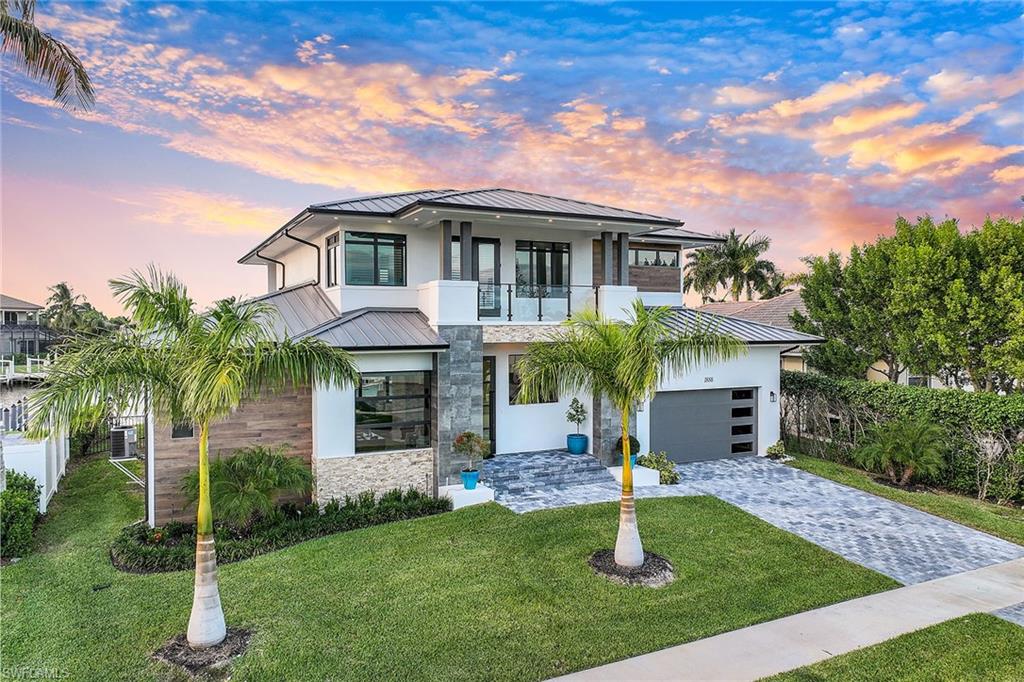Gorgeous new contemporary home just completed in April 2023. Beautiful converging wide and long water views with breathtaking sunsets, and direct access to the Gulf of Mexico. Impeccably designed four-bedroom, 4.5-bath residence plus a study, and a large loft with private balcony. High-quality features, fixtures, and finishes throughout. All bedrooms with en suites and walk-in closets. Gourmet chef’s kitchen with island, breakfast bar and separate dining area. Oversized impact-glass doors throughout the whole back of the home immersing you into Marco Island nature, you will be certain this is paradise. Watch the dolphins play from your expansive open veranda with saltwater pool, spa, summer kitchen and plenty of room for entertainment. Front and rear balcony made of concrete for worry-free long-term enjoyment. Fully furnished. Quiet low-traffic street, and half-mile from the plaza with shopping and dining. This home is a must-see and the ideal opportunity to start living the island lifestyle today!