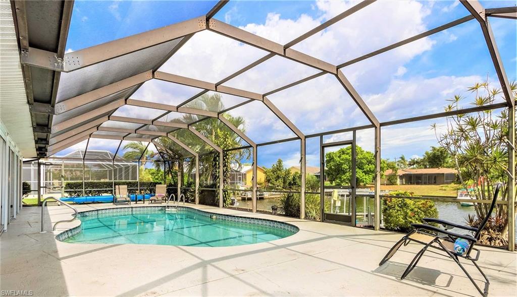 This is a VACATION RENTAL only. Owners will not consider annual rentals. Weekly rentals are welcome.
Villa Lilly is a 3-bedroom, 2-bathroom property on a gulf access canal with an electric-heated pool. This home sleeps a maximum of 6 guests (including children) and is not pet friendly.

· · · · · PROPERTY PERKS · · · · ·
- Bicycles
- Ping pong table
- Boat lift

· · · · · LOCATION · · · · ·
- Located in Southeast Cape Coral
- Close to Horton Park & Boat Ramp
- Close to Four Mile Cove Ecological Preserve

· · · · · LIVING AREAS · · · · ·
- Flat-screen TV
- Comfortable seating

· · · · · KITCHEN & DINING · · · · ·
- Fully equipped
- Dining area with seating for 6
- Breakfast nook with seating for 4

· · · · · BEDROOMS · · · · ·
- Primary Bedroom: King bed, sliders to the pool & flat-screen TV
- 2 Guest Bedrooms: Queen beds in each, a slider to the pool in one, a desk is available in the other

· · · · · BATHROOMS · · · · ·
- Primary Bathroom: Single-sink vanity & shower, also doubles as the pool bathroom
- Guest Bathroom: Shower/tub combo with a single-sink vanity

· · · · · OUTDOOR LIVING · · · · ·
- Electric heated pool
- Southern pool exposure
- Multiple lounging areas under shade
- Sun loungers
- Grill
- Boat dock & lift available

· · · · · THIS HOUSE IS GREAT FOR · · · · ·
Travelers looking for a property near the river & a quick drive to Fort Myers/Fort Myers Beach.