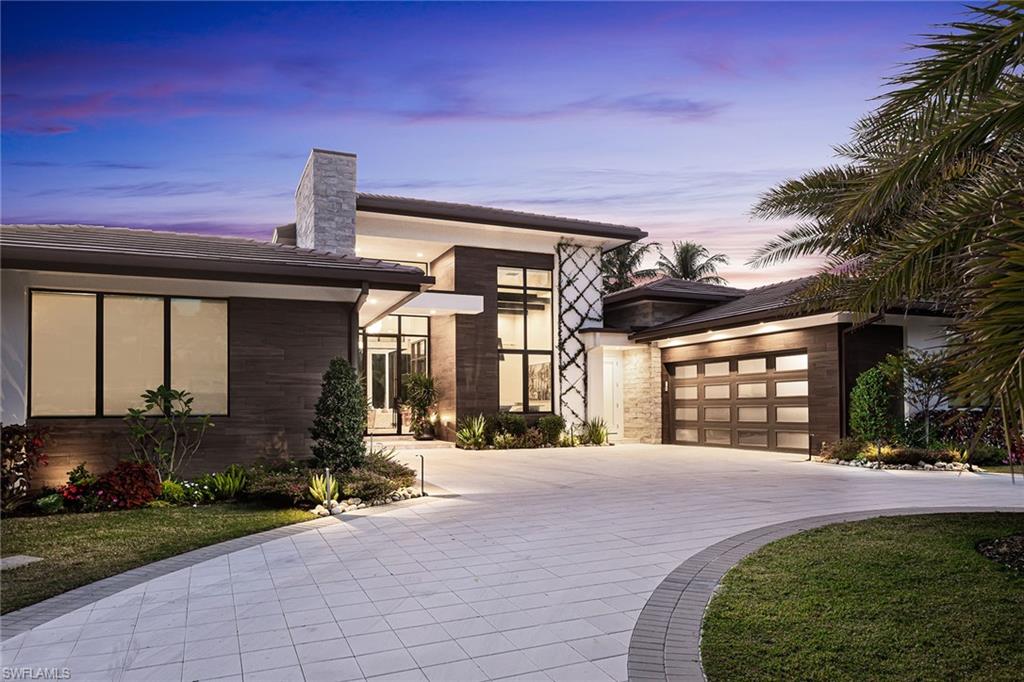 Located in Park Shore, this incredible property offers unmatched walkability to Starbucks, Fresh Market, Residents' private beach, and the upscale shopping and dining at Venetian Village.  With masterful design and expert craftsmanship, this Arthur Rutenberg custom home is the pinnacle of luxury living, boasting custom design features including exquisite ceiling details, expansive transom windows and 14 feet of pocketing glass allowing for natural light to flood the home, highlighting the wide-plank flooring throughout. Designed for entertaining, the kitchen features Thermador appliances, working pantry with built-in coffee system, and a stunning hand-carved breakfast bar. The residence offers spacious bedrooms, along with a stunning glass study and a generous laundry room with a dedicated delivery center for incoming packages. The primary bath feels like your sanctuary, complete with a soaking tub, fireplace and large shower overlooking a Zen garden with a water feature. Custom-designed backyard is an oasis for entertaining with saltwater pool, separate bar and grilling area, an herb garden, automated screens and outdoor fireplace. Additional features include a built-in Trax pest control system, mosquito mist system, Kinetico water purifying system, portable generator and a 1,000-gallon propane tank. The backyard is secured with a cane toad fence for added peace of mind for your pets.  Enjoy the perfect blend of convenience and luxury in one of Naples' most desirable neighborhoods! This home is one of the season’s most exceptional offerings.