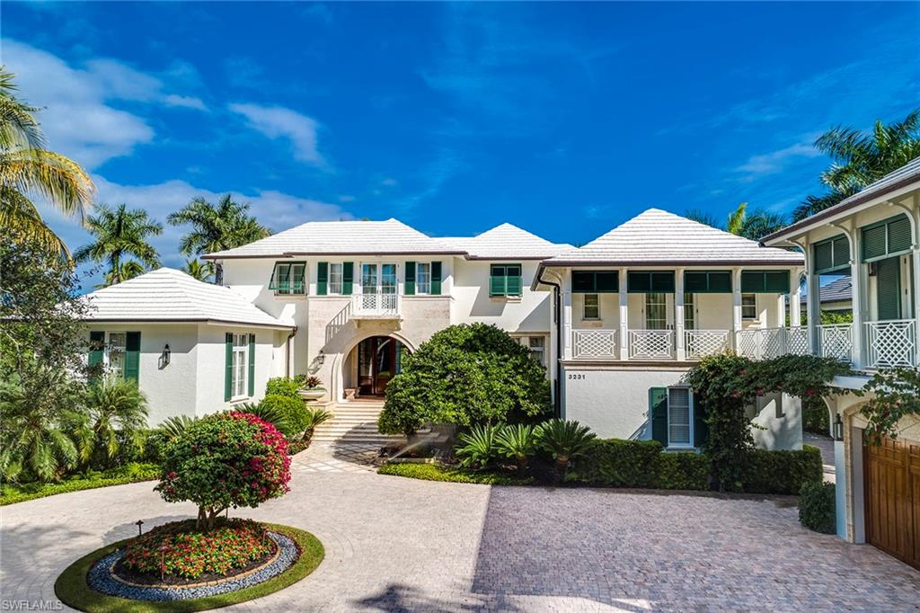 Basking in a private setting on an oversized lot overlooking the wide water views of Old Harbour Cove sits an exceptional custom-built estate that evokes grandeur. Beautifully designed the home offers six well-appointed guest en-suites, his-and-her private bathrooms, a study, elegant dining spaces, wine room and a spacious living room complete with separate dry bar. The well-appointed kitchen features a natural pallet and top-of-the-line appliances the include SubZero, Wolf and ASKO.  Walls of windows and pocketing glass doors transition the indoor spaces into the tropical outdoor setting complete with an expansive covered lanai, Wolf built-in grill, expansive pool, spa and custom putting green. A boat dock conveniently sits on the edge of the property for the added enjoyment of fishing and or boating with direct access to the waters of the Gulf of Mexico. Conveniently located within close proximity to the Port Royal Beach club and its recreational amenities, this one-of-a-kind gem completes of the best Naples has to offer.
