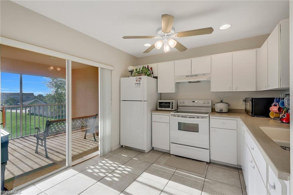 PICTURE PERFECT!! ~ Impeccably maintained 2nd floor condo with screened in lanai and beautiful sunset views! This 2/2 with a carport has tile in the main areas, carpet in the bedrooms, an open floor-plan concept and tons of natural lighting through the kitchen area. This is a great Southwest Florida vacation spot, only minutes to downtown Cape Coral, Tarpon Point Marina, Cape Harbour & The Boathouse - Yacht Club area! Has the potential to rent for a minimum of $1,000 monthly to an annual tenant and more for seasonally furnished renting. Washer & dryer are inside the home and will be staying. Well worth seeing and at this price will not last long!