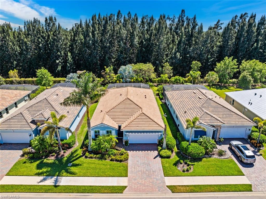 Welcome to this exceptional 4-bedroom, 2-bath pool home in the highly sought-after Egret’s Landing neighborhood of Naples Reserve, where luxury, comfort, and resort-style living come together seamlessly.

From the moment you step through the elegant glass front entry door, you'll be greeted by a bright, open-concept floor plan enhanced by ceramic tile flooring throughout and thoughtfully designed spaces ideal for both everyday living and entertaining. At the heart of the home is a stunning gourmet kitchen featuring quartz countertops, premium stainless steel appliances, under-cabinet lighting, and an expansive island perfect for gathering with family and friends.

The spacious primary suite serves as a private retreat, complete with dual vanities, granite countertops, mirrored medicine cabinets, and professionally customized California Closets. Every closet throughout the home has been thoughtfully designed to maximize storage and organization.

Step outside and discover your own tropical oasis. The screened-in pool and lanai are surrounded by lush landscaping accented by mature palm trees, vibrant crotons, and striking agave plants, creating a peaceful and private setting. The recently added outdoor kitchen with built-in grill makes entertaining effortless, while custom landscape lighting enhances the ambiance well into the evening.

Additional upgrades include front windows that are impact-resistant windows, electric and accordian shutters for back windows and sliders, plantation shutters, a phantom screen entry, upgraded lighting fixtures, custom laundry room cabinetry, epoxy garage flooring, garage air conditioning, enhanced garage lighting, and built-in shelving for exceptional storage and functionality.

Naples Reserve is renowned for its unparalleled resort-style amenities, including a gated and guarded entrance, 22 scenic lakes, a one-mile rowing lane, boat ramp, state-of-the-art fitness center, tennis, pickleball, basketball, sand volleyball, and bocce courts. Residents also enjoy a lakeside tiki bar, resort-style pool with lap lanes, playground, and miles of walking and biking paths.

Ideally located just minutes from shopping, dining, entertainment, and Naples’ world-famous Gulf beaches, this beautifully upgraded residence offers the perfect opportunity to enjoy the Naples lifestyle at its finest.