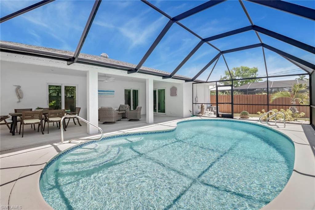 4.25% Assumable Rate mortgage!  This home did not flood with hurricane Ian. Located in north Collier County just minutes from Barefoot Beach sits this beautifully updated 3-bedroom, 3 full bath single family pool home. Brand new appliances, cabinets, flooring, paint and all fixtures. Enjoy the expansive covered lanai that overlooks your fully fenced back yard and Heated pool.  This non-HOA neighborhood has zero rental restrictions and several top-notch restaurants within walking distance. Residents can also purchase a membership for boat ramp/kayak launch privileges for a small yearly fee.