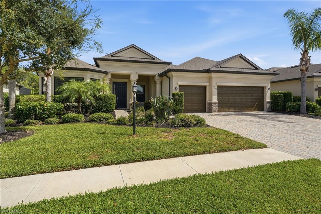 Welcome to 14189 Mindello Drive, located in the gated community of Portico in Fort Myers. Ideally positioned on a low-traffic street near the front of the community, this move-in-ready home is close to the clubhouse and resort-style amenities while offering convenient access to the community's main entrance. Built in 2018, this single-story pool home offers five bedrooms, three full bathrooms, 2,925 square feet of living space, and a spacious three-car garage, providing the perfect balance of comfort, style, and functionality. Designed for both everyday living and entertaining, the thoughtfully designed floor plan features tile flooring throughout the main living areas and bathrooms, complemented by luxury vinyl plank flooring in two guest bedrooms for a clean, modern, low-maintenance finish. The heart of the home is the oversized kitchen, showcasing white shaker cabinetry, granite countertops, stainless steel appliances, a large breakfast bar, separate dining nook with a picture window, and a spacious walk-in pantry. The kitchen flows seamlessly into the inviting family room, while a separate living room and formal dining room provide multiple spaces for relaxing or entertaining. Sliding glass doors open to a covered, screened lanai overlooking your private backyard retreat. Enjoy year-round outdoor living with a beautiful heated swimming pool, an expansive under-truss seating area, and additional space for outdoor dining and lounging. Privately located at the rear of the home, the spacious primary suite features tray ceilings, a seating area, an oversized custom walk-in closet with built-in shelving, and a luxurious en-suite bath with dual vanities, a soaking tub, and an enclosed walk-in shower. The split-bedroom floor plan offers privacy for owners and guests alike. Two guest bedrooms share a full bathroom, while a third guest bedroom is adjacent to a full bathroom that also serves as the pool bath, ideal for visitors or multigenerational living. A fifth bedroom at the front of the home features a bay window, making it well suited as a bedroom, home office, or flex space. Additional highlights include an interior laundry room with white shaker cabinetry, a utility sink, extra storage, and the added benefit of no flood insurance required. Residents of Portico enjoy resort-style amenities, including a clubhouse, resort-style pool and lap pool, fitness center, tennis and pickleball courts, basketball court, playground, and year-round community events. The community is pet-friendly, with fences and low-speed vehicles (LSVs) permitted. Conveniently located in the desirable Buckingham area of Fort Myers, Portico offers easy access to I-75, Downtown Fort Myers, Southwest Florida International Airport, shopping, dining, and entertainment. Combining generous living space, thoughtful upgrades, exceptional amenities, and a prime location, 14189 Mindello Drive offers the ideal Southwest Florida lifestyle and is ready to welcome you home.