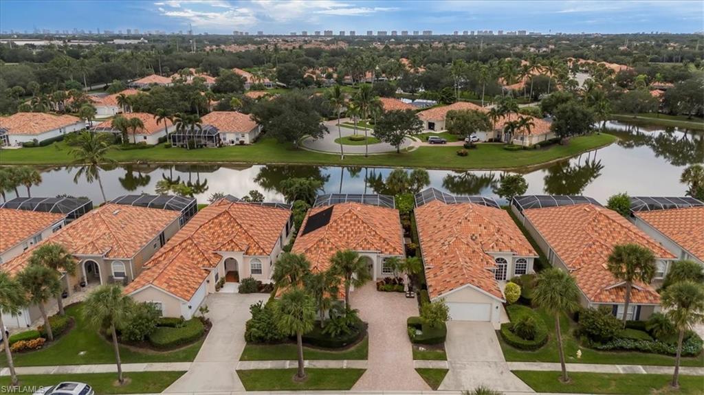Sunset views and resort-style living in Village Walk in beautiful Naples, FL! Enjoy breathtaking sunsets every night from your own private, western-facing, solar-heated pool. This outstanding, reimagined Oakmont floor plan offers 3 bedrooms, a den/home office, 3 full baths, and a 2-car side-load garage with an epoxy floor and brick paver driveway. The stunning kitchen showcases custom cabinetry, quartz countertops, a freestanding island, and Café appliances - perfect for entertaining. The primary suite features generous closet space and a beautifully renovated bathrooms (2 primary bathrooms) highlighted by a striking tiled feature wall. Additional upgrades include 20-inch porcelain tile set on the diagonal, roof replaced in 2019, new AC in 2023, freshly painted exterior with the new HOA approved color pallet, crown molding, hurricane protection, and a custom built-in bar. The home’s private setting backs to a cul-de-sac with no direct neighbor behind and is surrounded by lush landscaping and charming potted plants. Located in an interior section of the community, this residence offers peace and privacy while being close to everything. Village Walk is one of North Naples’ most sought-after communities—just under 5 miles to Vanderbilt Beach and the shopping and dining at Mercato. Residents enjoy an active lifestyle with tennis, pickleball, a fitness center with lap pool, two resort pools, a restaurant, miles of scenic walking paths, and more!