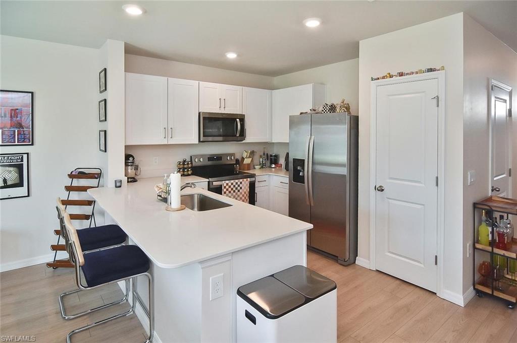 THE LOWEST PRICED TOWNHOME IN THE COMMUNITY .... Welcome to this beautifully designed townhome offering the perfect blend of style, comfort, and functionality. Boasting 1,463 square feet of thoughtfully designed living space, this move-in-ready residence features three spacious bedrooms, two-and-a-half bathrooms, IMPACT-RESISTANT WINDOW AND DOORS, fresh interior paint, security system and LIGHTS AND FANS already installed. The well-designed floor plan provides ample room for families, guests, or a flexible work-from-home lifestyle.

The modern kitchen and bathrooms are appointed with elegant quartz countertops, HANDLES on cabinets, delivering both durability and timeless appeal. Luxury vinyl flooring flows throughout the main living areas, creating a contemporary look with easy maintenance, while plush carpeting in the bedrooms provides warmth and comfort.

Designed with today's homeowner in mind, this exceptional townhome combines quality finishes, practical living spaces, and modern conveniences to create a home that is as functional as it is beautiful. Whether you're a first-time homebuyer, seasonal resident, or investor, this property presents an outstanding opportunity to enjoy stylish, low-maintenance living in a desirable setting. CALL YOUR AGENT TODAY FOR A SHOWING!