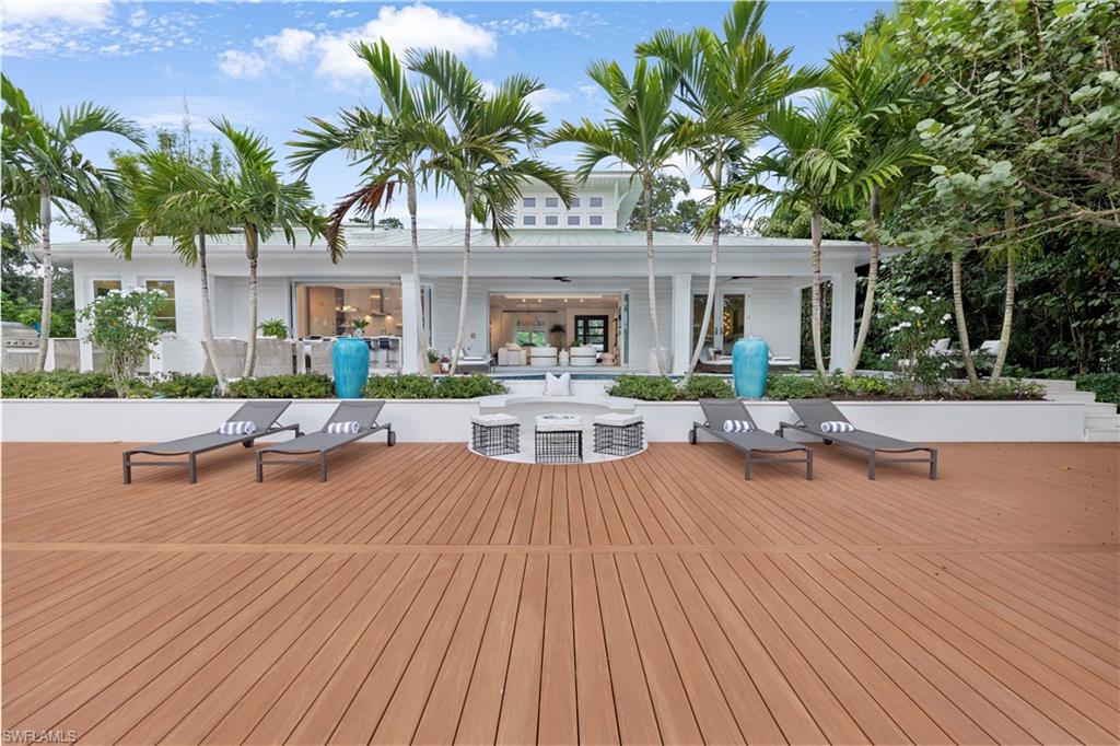 Completely refashioned with a sophisticated eye, this chic waterfront paradise overlooks a canal in Seagate. Designer-curated finishes and fabrics throughout all the way down to the wall coverings, light fixtures and other bespoke details like a gorgeous wine wall pay homage to the Naples lifestyle. An open floorplan achieves seamless indoor/outdoor flow via expansive walls of glass opening to the lanai, where a pool, spa, outdoor kitchen and largest dock in Seagate await. The home boasts a standout theater lounge that doubles as an oversize bunk room.
A quiet, tucked-away location in Seagate, a hidden gem community of only 90 homes, allows you access to a private residents-only beach club. Located on a canal, where you can launch paddle boards, kayaks or jet skis right from your backyard, through Clam Pass to the Gulf of Mexico. A prime location also puts you within walking distance to Waterside Shops, with its elevated shopping and dining hotspots, plus Naples Grande Beach Resort and Sea Gate Elementary, one of the top public schools in all of Florida. If you want move-in ready style and barefoot luxury at its best, look no further than this flawless oasis.