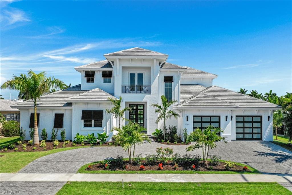Brand New build nearly complete, with wide open Bay Views and direct access. Coastal contemporary impeccably designed 4 bedroom 4 bath home with high quality features, fixtures and finishes highlight the tremendous open and dramatic great room floor plan for unsurpassed entertaining. Oversized impact glass doors with 12 ft ceilings. A 3 car garage (one side is 40 ft long with rear overhead door for yacht loading, for offshore fishing or extended cruising) and a circular drive allows for additional parking. Deep water quick out to the river. Build your custom dock. The substantial lanai deck and pool includes a fireplace and summer kitchen. Within approximately 30 days of completion.