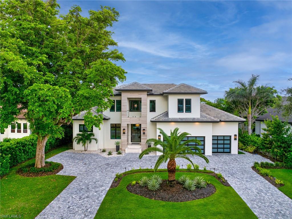 Stunning custom 2023 built home! Full 2-10 HOME WARRANTY INCLUDED. View the 3D WALK THROUGH VIDEO.
This meticulously designed and decorated by Clive Daniel and Robb & Stucky interiors, features 5 bedroom/ en suites, plus a Pilates/yoga studio and is designed with an elevator from the garage level up to the main floor and second floor of the home. The primary bedroom features his and her walk-in California Closets, a large walk in shower, a free standing tub, electric blackout hunter Douglas shades and 2 private Japanese smart toilet rooms. Entire home offers an array of technology throughout and is powered by Savant Automations’ new *brilliant smart home system* with video audio and sound controlled from every area of the house. Enjoy the expansive family room with floor to ceiling Anderson pocket sliding glass doors that allow plenty of light. Chef's Kitchen is equipped with Sub-Zero, Wolf and Asko Appliances with a full butler's pantry and 2 sub zero wine towers with 4 refrigeration drawers and wide plank legno bastone flooring throughout. 
The second floor offers 3 en-suites with private balconies along with a large bonus room that can be used as a home theatre or game room. Relax by your Resort Style salt water pool/spa with a 900 sq ft covered lanai area with electric roll down screens and shutters, a fireplace, 85” TV with 10 outdoor speakers perfect for entertaining. A built-in outdoor kitchen with grill, subzero refrigeration and ice maker. This Moorings masterpiece is within minutes to Historic Downtown Naples, Four Seasons and white sugar sand beaches. Gorgeous home sits on one of the largest lots. 12 Foot Elevation.