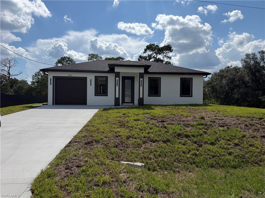 A home built in 2026 in an excellent location, featuring a modern and bright design, and ready for immediate occupancy. It offers 3 bedrooms, 2 bathrooms, and an open-concept layout - perfect for entertaining guests and creating unforgettable moments. The spacious kitchen features elegant cabinetry and includes stainless steel appliances (electric range, refrigerator, dishwasher, and microwave), as well as a washer and dryer. All appliances come with a 3-year warranty. Situated outside a flood zone (flood insurance is not required), the home features impact-resistant windows and doors, and sits on a 0.50 acre with ample space to build a pool, a gazebo, or pursue other future projects. Enjoy excellent connectivity, with shops, restaurants, Fort Myers, and major access roads just a short distance away. Seller concessions are available for strong offers; request more information and schedule your showing today! ***New homes like this sell fast!