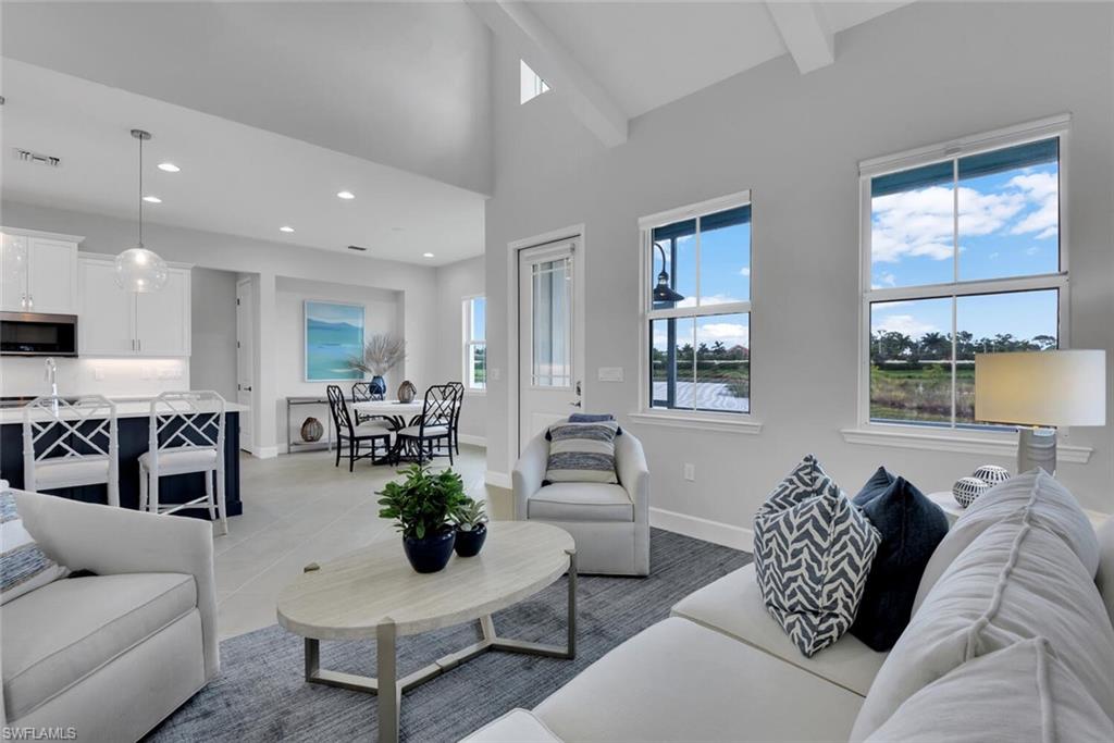 Experience the charm of Saona Cottage, bathed in abundant natural light and situated in the highly sought-after Isles of Collier Preserve community. Enjoy serene living with standout features including a master bedroom with a king-sized bed, an en-suite bathroom, and a spacious walk-in closet. The guest room offers a cozy queen-sized bed, while the den is outfitted with a sleeper sofa, perfect for additional guests. Additional comforts include a laundry room and a screened-in lanai for ultimate relaxation. Living in The Isles of Collier Preserve means embracing a lifestyle of luxury and nature. This vibrant community offers an array of amenities, including pickleball, tennis, a resort-style pool, a lap pool, a fitness center, water sports, and the exclusive waterfront bar and grill, The Overlook. Choosing The Isles of Collier Preserve as your vacation base provides the perfect gateway to explore all the enchanting offerings of Naples, from the chic downtown 5th Avenue to the pristine beaches, and beyond to the scenic routes leading to Marco Island.
