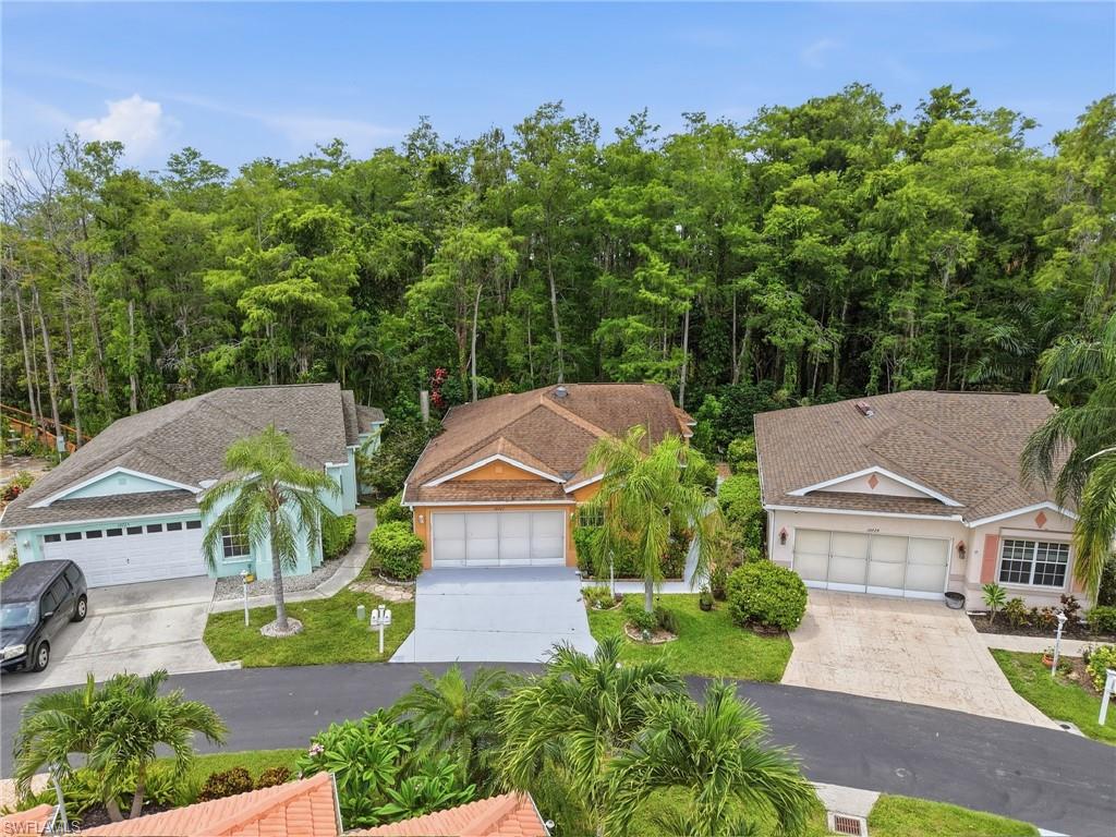Discover exceptional value in the gated community of Island Club with this move-in ready 2-bedroom plus den home offering peaceful preserve views, an open floor plan, and a rare 291-square-foot air-conditioned sunroom that significantly expands the home’s functionality and enjoyment beyond the 1,271 square feet under air. Filled with natural light, the spacious interior features soaring 9.5-foot ceilings, a solar tube skylight, freshly re-grouted tile floors, an updated kitchen with wood cabinetry and granite countertops, and a convenient mudroom pantry between the kitchen and garage. The flexible den is ideal for a home office, hobby room, or guest space, while the split-bedroom layout provides privacy for owners and visitors alike. The primary suite features direct sunroom access, a walk-in closet, and an updated en-suite bathroom. Outside, lush tropical landscaping surrounds a private paver patio, creating the perfect setting for grilling, relaxing, or enjoying tranquil preserve views. Additional features include a 2021 roof, 2021 A/C, 2024 mini-split serving the sunroom, epoxy-coated garage floor, garage screen doors, and golf cart included with purchase. Roll down hurricane shutters for your peace of mind. Seller financing available at 1% below current market rates for qualified buyers. Not located in special flood zone. This community has never has flooding issues from hurricanes. Ideally located west of I-75 between Naples and Fort Myers, you’re just minutes from Gulf beaches, RSW International Airport, FGCU, Coconut Point, Miromar Outlets, and the shopping, dining, and entertainment Southwest Florida is known for. Island Club is a gated community of approximately 250 single-family homes centered around a scenic 23-acre lake, with affordable HOA fees of just $820 per quarter including water, sewer, cable, and lawn maintenance. Residents enjoy a lakefront clubhouse, community pool and spa, fitness room, tennis, pickleball, shuffleboard, bocce, cornhole, library, and social activities, with recently refinished tennis and pickleball courts. Whether you’re searching for a seasonal retreat, first home, investment property, or full-time Florida residence, this home’s rare air-conditioned sunroom, major system updates, peaceful preserve setting, and exceptional community amenities make it a standout opportunity in the heart of Estero.