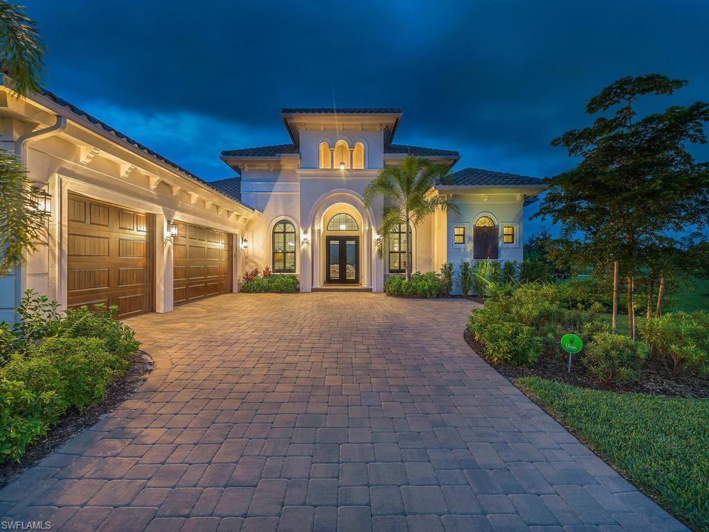 This exclusive Stock Signature estate home welcomes you with a timeless elegance of today's contemporary, open floor plan living. This home has been perfectly designed for entertaining with a bright & airy main living area that opens to an expansive covered lanai with an outdoor kitchen, a sparkling saltwater pool & spa overlooking a beautiful lake with the golf course in the distance. Don't miss this unique opportunity to purchase a pristine, like-new home built with numerous luxury appointments, including the additional owner-added designer lighting, fans & plantation shutters. The home is situated on one of the best lots within the community with its peaceful cul-de-sac location & spectacular sunrise views. Esplanade Golf & CC is Naples newest luxury gated golf course community. Besides the 18-hole course designed by Chris Wylczinski residents enjoy a resort lifestyle with amenities that include a pro shop, Har-tru tennis courts, a 15,000 sq. ft. clubhouse, a resort-style pool, a lap pool, a wellness center & spa, bocce and tiki bar & grill with poolside service. The community is lushly landscaped with extensive walking/biking trails and over 1,000 acres of preserves & lakes.