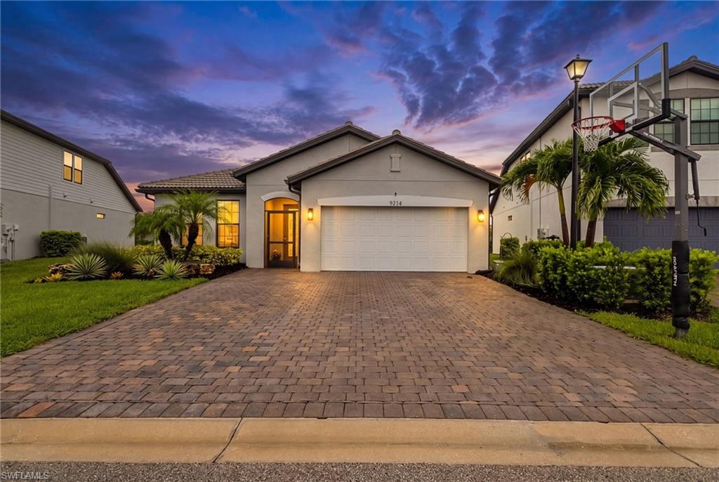 Experience elevated Southwest Florida living in this impeccably updated pool home, where contemporary design, smart-home technology, and tranquil fountain views create an exceptional lifestyle in the gated Westbrook community. A custom inset-glass front door, dramatic five-foot architectural handle, screened entry, and professionally designed landscaping establish an unforgettable first impression. Inside, the light-filled open-concept floor plan is unified by luxury flooring, updated baseboards, modern ceiling fans, and sophisticated black hardware throughout.

The beautifully reimagined kitchen serves as the centerpiece of the home, featuring quartz countertops, a custom quartz island, designer backsplash, deep charcoal sink, and Samsung Bespoke AI Family Hub refrigerator with dual ice makers. Expansive living and dining areas transition effortlessly to the screened lanai, creating an ideal setting for everyday comfort and effortless entertaining. A dedicated media room is enhanced by custom doors and a dramatic designer accent wall, while the serene primary suite showcases its own custom feature wall and a spa-inspired bathroom with a frameless glass shower enclosure and illuminated niche. The guest bathroom is equally impressive, offering a custom-tiled shower surround and backlit designer niche.

Outdoors, a private screened pool with color-changing LED lighting sets the stage for evening gatherings beneath the Florida sky. Intentionally understated rear landscaping preserves the beautiful water and illuminated fountain views, while the covered lanai provides a welcoming space for lounging and alfresco entertaining. 

Additional improvements include a widened and professionally sealed driveway, sealed patio, premium basketball hoop, professional two-part epoxy garage floor, new washer and dryer, added laundry cabinetry, and an HVAC system enhanced with Blue Light UV air purification. Ring cameras monitor the front door, driveway, garage, and lanai, with front-door camera integration available through the Family Hub refrigerator display. 

Westbrook residents enjoy resort-style amenities, including a community pool, clubhouse, fitness center, playground, fire pit, and grilling areas. Ideally positioned near Three Oaks Parkway and Alico Road, this Fort Myers pool home offers convenient access to Gulf Coast Town Center, Florida Gulf Coast University, Southwest Florida International Airport, I-75, dining, entertainment, and the Gulf beaches—delivering polished design, modern convenience, and an enviable Southwest Florida lifestyle.