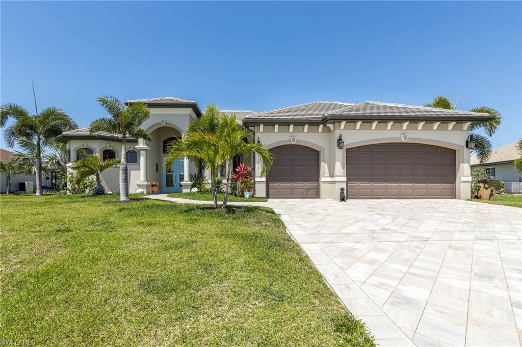 CUSTOM BUILT 3 BEDROOM PLUS A STUDY, 3 BATH, 3 CAR GARAGE HOME ON A TRIPLE LOT WITH A SALTWATER POOL. ENJOY EXPANSIVE WATER VIEWS FROM YOUR OVERSIZED PAVER, SCREENED LANAI WITH PICTURE FRAME SCREENS, 3 UPGRADED CEILING FANS, AND A BEATUFUL OUTDOOR KITCHEN WITH GRANITE AND A SEPARATE SINK. THIS HOME HAS ALL OF THE BELLS AND WHISTLES, INCLUDING HURRICANE GLASS ON ALL DOORS AND WINDOWS, PORCELAIN TILE ON THE DIAGONAL, WITH ENGINEERED HARDWOOD FLOORING IN THE MASTER BEDROOM AND STUDY, BUILT IN BAR WITH WINE COOLER, AND AN OPEN CONCEPT GREAT ROOM WITH HIGH COFFERED CEILINGS AND MOOD LIGHTING. PLENTIFUL SOLID WALNUT CABINERTY IN KITCHEN WITH UPPER AND LOWER LIGHTING, LEVEL 4 GRANITE IN KITCHEN, BATHS, AND OUTDOOR KITCHEN. IN THE MASTER BATH YOU'LL FIND NEW SEAMLESS GLASS SHOWER DOORS,AND SHOWER HEADS, DUAL SINKS WITH MAKE UP AREA AND HUGE WALK IN CLOSETS. 4 SETS OF SLIDERS TO LANAI, AND A HUGE OVERSIZED DEEP GARAGE ADD TO THE CHARM OF THIS HOME. ON A HORSESHOE STREET WITH CANALS ON EITHER SIDE AND ACROSS THE BACK. HIGH DEMAND AREA OF NEW CONTRUCTION, CLOSE TO SHOPPING, RESTAURANTS, AND PUBLIC BOAT RAMP. CATCH FISH, OR ENJOY WATCHING MANATEES AND THE OCCASIONAL DOLPHIN OR TARPON PASS BY.