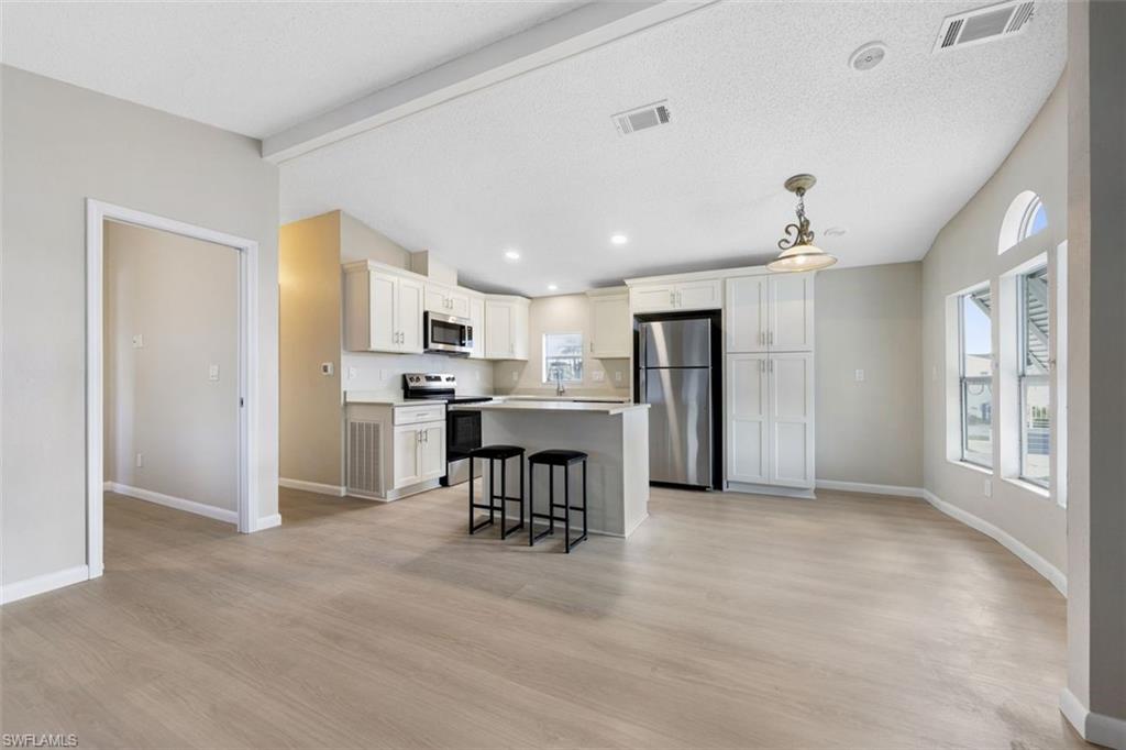 Own the Land | Steps from the Beach | Fully Renovated | Gated 55+ Community,
 Welcome to Palmetto Palms — one of Southwest Florida's most sought-after 55+ gated communities, where you own the land and live just a short walk from Bunche Beach and a couple of miles from the world-famous Sanibel Island. This beautifully renovated home has been completely remodeled, featuring a brand-new central A/C system (2026), a fully remodeled open-concept kitchen with modern finishes, all-new appliances, updated bathroom vanities, and stunning new flooring throughout. Every detail has been thoughtfully upgraded. Unwind on your private screened porch or take advantage of Palmetto Palms' exceptional resort-style amenities, including: Two community pools, Pickleball & tennis courts, shuffleboard, horseshoes, and volleyball, Fitness & wellness — yoga and exercise classes, Organized activities — golf league, group bike rides, cards, quilting, cornhole, bingo, Happy Hours, and Hot Dog Tuesdays, RV & boat storage on-site — bring all your recreational toys. With beaches, shopping, and dining just minutes away, this home offers the perfect blend of an active lifestyle and coastal convenience. Whether you're looking for a full-time residence or a seasonal retreat, this is the Florida lifestyle you've been dreaming of. Opportunities like this don't last — schedule your showing today.