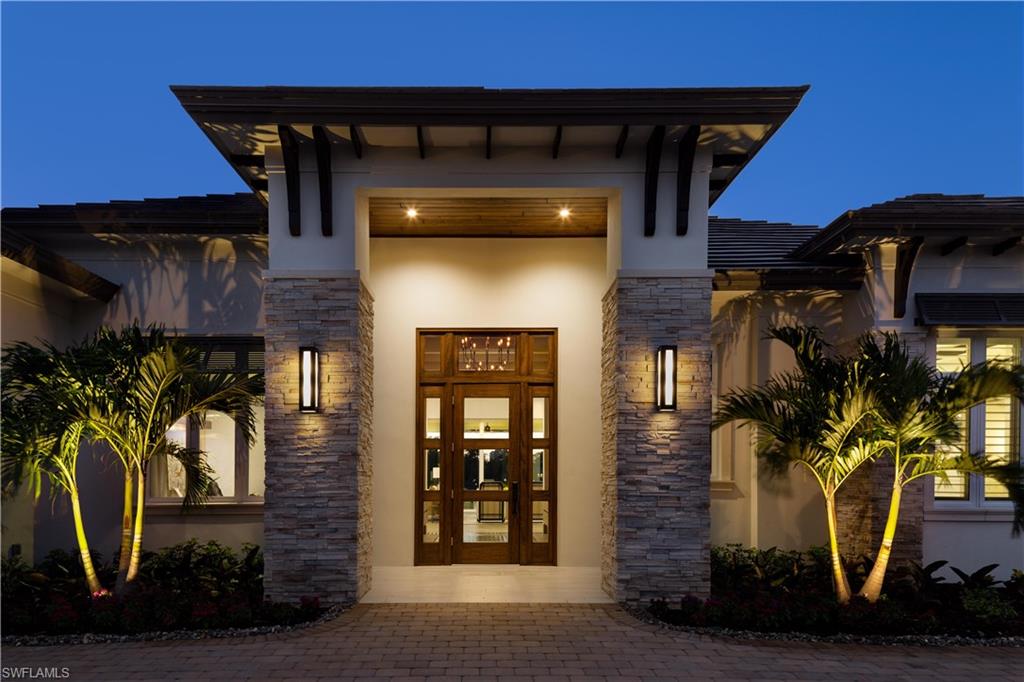 Come visit this exceptional furnished home located in the highly sought neighborhood of Pine Ridge Estates.  
This magnificently finished modern home boasts an outstanding lake view and features a great room design, generous kitchen with 2 pantries, dining area with adjacent wine room, all overlooking the pool with infinity edge and the lake beyond.  In addition, the master suite has direct access to the pool and deck area, each of the guest suites has en-suite baths and walk-in closets, exceptional utility room, 4 car garage.  The covered lanai area features linear fireplace outdoor kitchen, fire pit, custom designer pool with fire bowls.  This is a must see home just completed by Divco Custom Homes. Sale Price included a furnishing package valued at $224,333.10 that is not reflected in the Property Records.