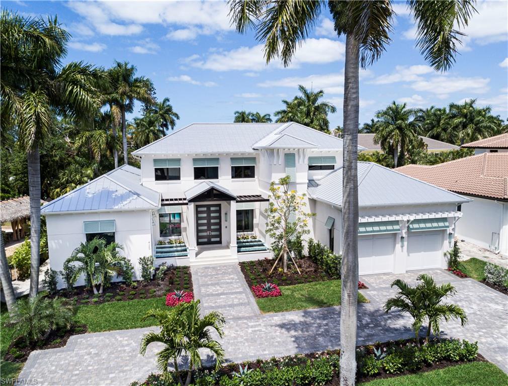 Premiere location and one of Naples's newest custom home offerings! This showcase residence was constructed by Gulfstream Homes, Kukk Architecture and Koastal Design Group. 425 Putter Point Dr. is a very quiet and lush treelined street west of Crayton Rd walking distance to the Moorings Country Club and short bike ride to the Moorings Beach Club. You can have it all in one of the most sought-after markets in Naples. 4478sqft under air, 4Br+Den, 6 Bath, 3 Car tandem garage with room for a lift and loaded with unparalleled finishes.  You will appreciate the artistic appeal of solid mahogany finishes at the front entry coupled with flowing water features and solid wood timbers.  This showcase masterpiece is all about intricate focal points, artistry and seamless flow as you move your way past the tranquil living quarters, inviting gourmet kitchen and spacious out door living areas. Pomeii Quartz throughout, Encore custom cabinetry, Thermador Appliances, Legno Bastone flooring, Andersen impact windows/doors, electric screens and shutters, 1000 gallon propane tank, 2 tankless water heaters, control 4 lighting and much more.