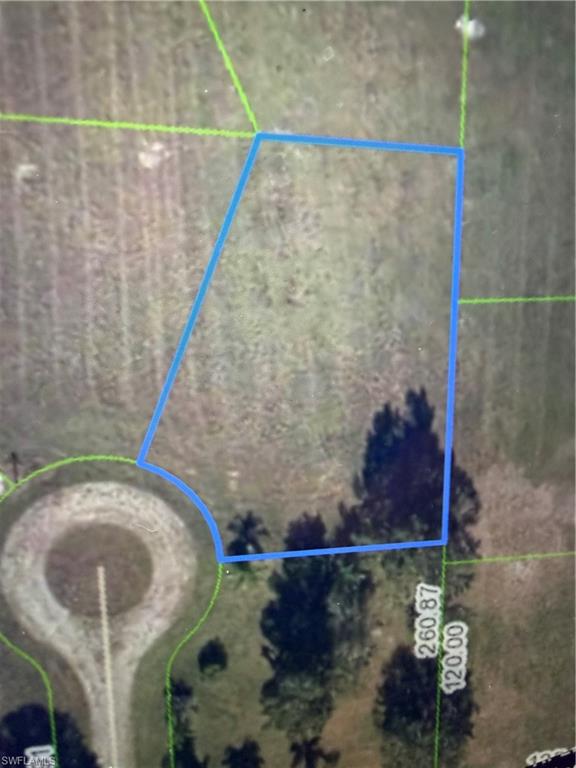 This is a large .425 acre lot in a very nice section of Sebring called Spring Lake Village.  It is close to Sebring International Speedway.  This area has space between the homes therefore a sought after place to build your dream home.  Get out of the crowded cities now in Florida and purchase this lot in this quiet neighborhood.  There is an association with small yearly fee.  The lot is on a cut de sac with the road grown over at this point getting to the lot.  Sebring offers a wonderful quality of life with a quant downtown with shops and restaurants, caladium festival every summer, many lakes to enjoy, access to Healthcare, and so much more.