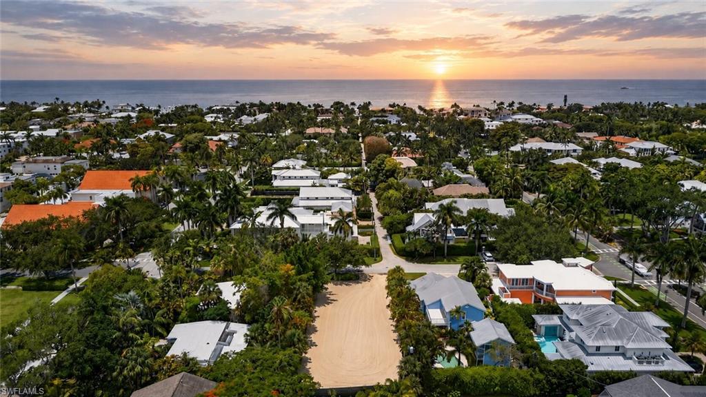 One or more photo(s) has been virtually staged, AI generated or rendered.  An exceptional opportunity to create a custom luxury residence in one of Old Naples' most coveted locations. Perfectly positioned just three blocks from the Gulf (approximately a 3-minute walk) and only four blocks from world-renowned Fifth Avenue South (approximately a 2-minute walk), you'll enjoy effortless access to the very best of Old Naples.
A standout feature is the property's location within the highly desirable X500 Flood Zone, a rare distinction in Old Naples that provides added peace of mind.
Preliminary site and building plans illustrate the potential for an extraordinary 4,100+ square foot luxury residence. Approved building plans are available for separate purchase, presenting a rare opportunity to bypass the lengthy planning and permitting process and begin construction almost immediately.