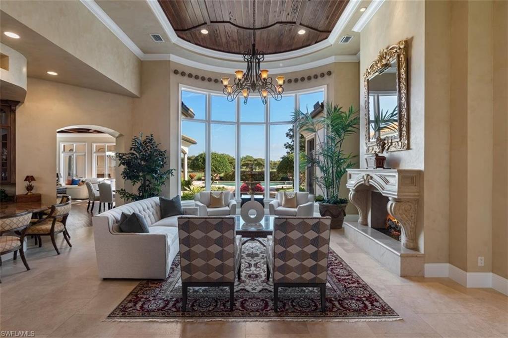 Breathtaking vistas beckon from this .49 acre manicured lot and former WCI Model Home!  Situated on the 14th fairway of Talis Park, this magnificent home showcases an array of upgrades including custom ceilings with pecky cypress, brick or handprinted artwork, a media room with updated equipment, three zone HVAC, one of the largest private pools in the community, a water fountain, outdoor fireplace, two indoor fireplaces, a morning kitchen in the owner's suite, three ensuite guest rooms, natural gas and amazing landscaping! The attention to detail that WCI placed in this showcase home is evident at every turn.  This one owner home has been impeccably maintained.  A Sports Membership valued at $35,000 is included with this home. Talis Park provides residents with an array of amenities including an 18 hole Pete Dye/Greg Norman designed course, state of the art clubhouse with a wine room and bar area, Fiona's Cafe', work out facilities, Esprit Spa, two dog parks, six Har Tru tennis courts, bocce, a billiards area with a golf simulator,  a beach shuttle and a busy social calendar.