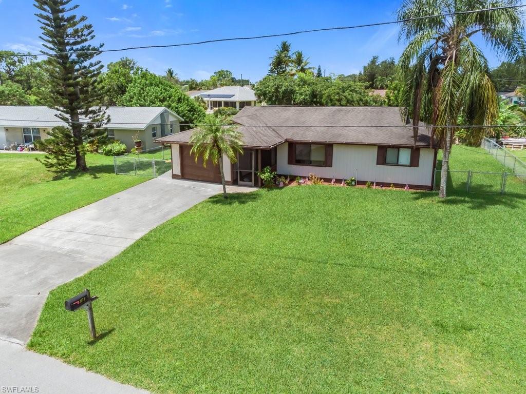 This perfect large canal home is now available for sale in Golden Gate City! This 3 bed/2 bath home is in great condition offering tile, carpet and wood laminate floors. Large fenced backyard with canal access! Only minutes away from Golden Gate Pkwy and I75 for easy access throughout the city, Near everything