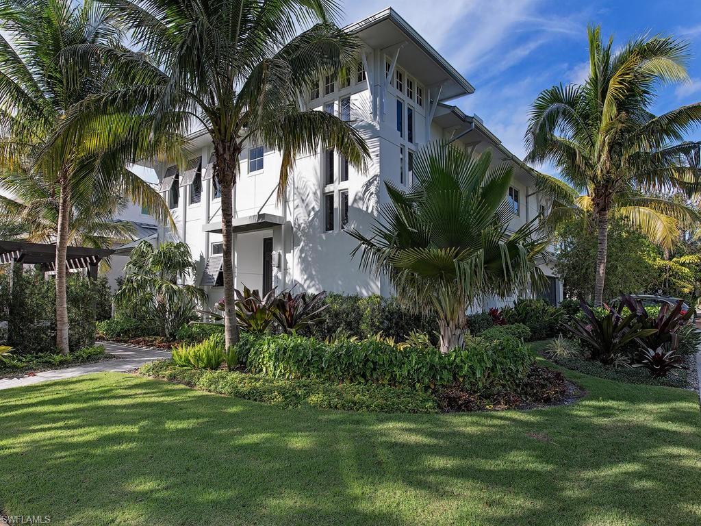 H.14008 - Exquisite MHK coastal design, furnished, decorated and ready for easy move-in. Built in 2016, ideally situated within walking distance of the beach and 5th Avenue shopping/dining. Casually elegant, seaside chic, this home flows through its 3,347 Sq. Ft. of contemporary, yet warm design and upscale finishes. Four bedrooms + den, wide-plank wood flooring, elevator to second floor. Intricate ceiling detail, custom lighting, fireplaces, luxurious baths! Gourmet kitchen boasts an open concept design with top of the line appliances, including a 5 burner Wolf gas stove, SubZero, quartz countertops, huge kitchen island, high style cabinetry, wine fridge. Luxurious first floor master suite has dual sinks, spacious shower. Guests will love the 2nd floor VIP suite w/huge soaking tub, spacious shower, second living area/den, plus 2 more bedrooms with a Jack & Jill bath. Great for entertaining w/summer kitchen, built-in gas grill & refrigerator. Enjoy the lovely pool and spa with water feature, privacy wall, lush, tropical ambiance, in your very own private sanctuary. Enjoy the fire pit or walk to the beach for glorious sunsets. Live the true Olde Naples lifestyle!
