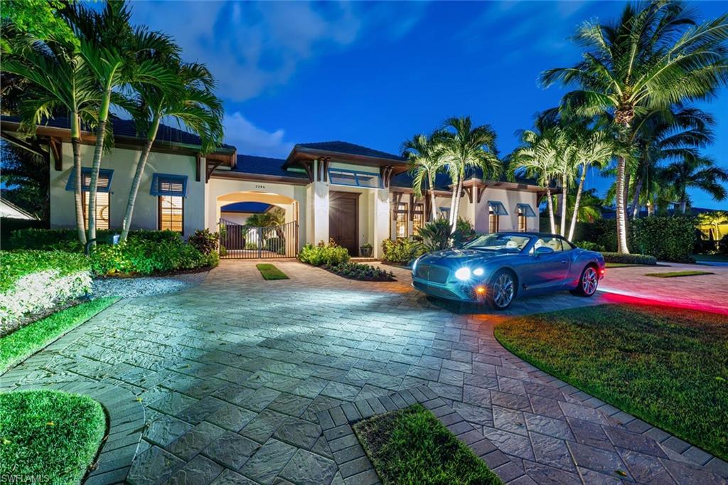 H3621 Stunning gated enclave. Coveted 1/2-acre lot in The Moorings. Exquisite 4-bedroom, den, 4 bath, 1-level, 4400 SF estate. Design elements: wood inlaid ceilings; 14-foot mahogany French doors; Chef’s gourmet kitchen boasts French La Cornue oven/range; twin oversized islands; built in Espresso; Subzero; Wolf; Miele; and all expected accoutrements. Glass walls open to outdoor veranda & pool blending indoor and outdoor spaces. Southern exposure. Outdoor space offers secluded park-like setting. Expansive great room features soaring wood inlaid cathedral ceiling accommodating gatherings of family or friends. Luxurious master suite offers a quiet respite. Breakfast kitchen, stunning soaker tub, oversized shower enclosure and massive closet space await. The 2nd master with breakfast bar, unmatched appointments and privacy.  The 2 additional oversized guest suites are En Suite, impressively appointed, and allow for private entry. The residence offers the latest in Smart home technology.  Interior and exterior shades, lights, audio-video, outdoor screens and shutters with touchscreen operation. This one-of-a-kind enclave has never been offered to the market since construction. Every desire met. Ideal location: short walk, bike, or buggy ride to Moorings Beach Park. About a mile to either 5th Ave S. or Venetian Village. See it today. Live it tomorrow!