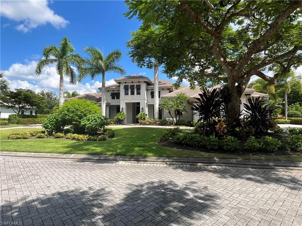 Exceptional, masterfully crafted home nestled on over 3/4 of an acre of lush landscape overlooking the golf course and perfectly sumptuous SWFL sunsets from the spacious lanai, created with entertaining in mind.  4 generous bedrooms, all en-suite offers ideal living and guest accommodations with personal privacy at the forefront. The primary is a sanctuary with a seating area, generous closets and leads to a spa inspired bath complete with dual sinks and a freestanding soaking tub with a separate shower with multiple shower heads. Graciously designed, this home is where you will love inviting your friends and family to.  The chef inspired kitchen has dual islands and the separate butler's pantry is perfect for storage and prepping. The Wine room boasts its own beverage cooler and is designed with intimate surroundings for wine tasting. Disappearing pocket sliding doors from the family room open your home to the beautiful outdoor living spaces and the 4-car attached garage is ready for your vehicles, golf cart and Florida toys!