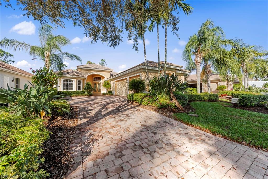 Immaculate 3 bed + den, 3 bath home with great room floor plan and 3-car garage.  Upgrades throughout include, crown molding, plantation shutters, large tile throughout main areas, disappearing sliders in great room lead out to the private paver lanai, for that sought after outdoor living space, with heated pool/spa and lush landscape surrounding and beautiful large lake.  Kitchen boasts built-in appliances, granite counter-tops, 42" cabinetry with crown molding, center island breakfast bar and breakfast room.  Large master suite offers large walk-in closet and built-in cabinets and French doors that lead out to the lanai.  Two extra bedrooms for family or guests one with large private bath.  Community of Grandezza offers many amenities and additional memberships  available to fit your lifestyle.  Ideally located in the sought after, growing city of Estero, right by Hertz Arena, FGCU, RSW airport, outdoor shopping malls, dining and only a 20-minute to SWFL beautiful white sandy beach.