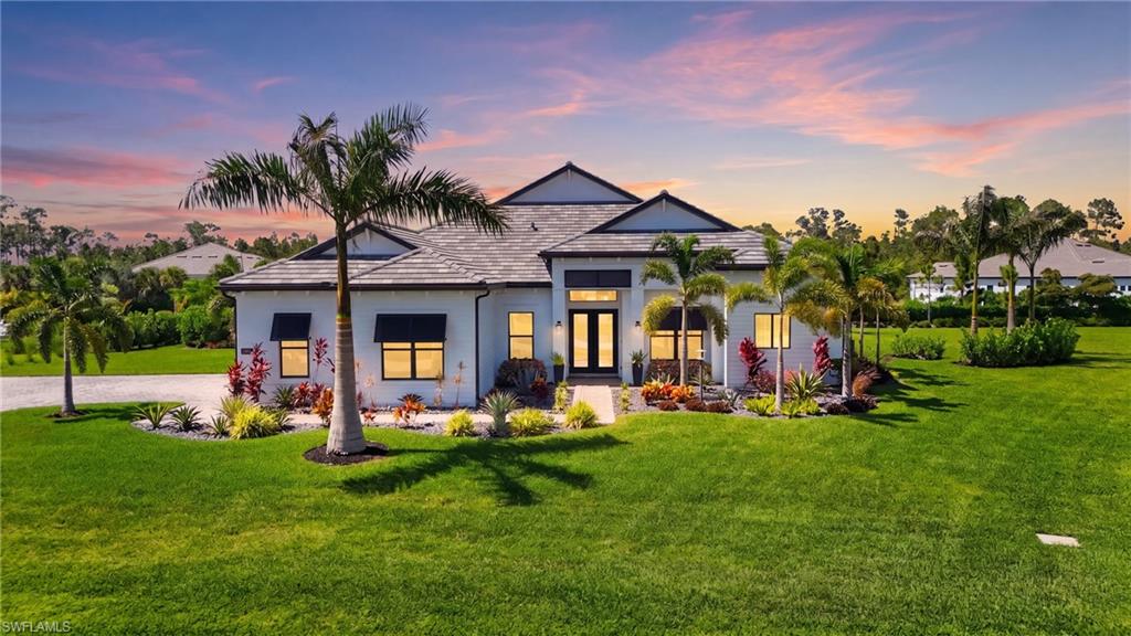 Welcome to your dream home in the exclusive gated community of Corkscrew Estates, a boutique community of just 59 estate homes. Situated on a private 0.9-acre homesite, this professionally designed residence combines luxury, comfort, and exceptional indoor-outdoor living.From the moment you enter, you’ll appreciate the impeccable attention to detail, including custom cabinetry, designer hardware, GAS APPLIANCES, volume ceilings, GENERAC GENERATOR, WATER PURIFICATION SYSTEM, and an elegant designer lighting package. The open-concept floor plan is ideal for entertaining, featuring dramatic zero-corner sliding glass doors that seamlessly blend the kitchen, dining, and living spaces with the expansive outdoor lanai.
The luxurious owner’s suite offers a private retreat with a spa-inspired bath, while three additional bedrooms and a versatile den provide plenty of space for family, guests, or a home office. A spacious laundry room with extensive cabinetry and a second refrigerator doubles as a convenient butler’s pantry.
Step outside to your own private resort-style oasis. The CUSTOM SALTWATER POOL showcases premium finishes, an EXTENDED LANAI, upgraded paver decking, dual sun shelves with decorative water bowls, elegant water features, and built-in umbrella stands for ultimate relaxation. A FENCED YARD offers peace of mind for children and pets, while upgraded mature landscaping and custom exterior lighting enhance both privacy and curb appeal.
Every room in this home is generously sized and thoughtfully finished with high-quality upgrades throughout. Meticulously maintained and beautifully decorated, this residence truly SHOWS LIKE A MODEL HOME.
Conveniently located near shopping, dining, Hertz Arena, Southwest Florida International Airport (RSW), I-75, and just a short drive to the white-sand beaches of Southwest Florida and the world-class dining, shopping, and entertainment of Naples.