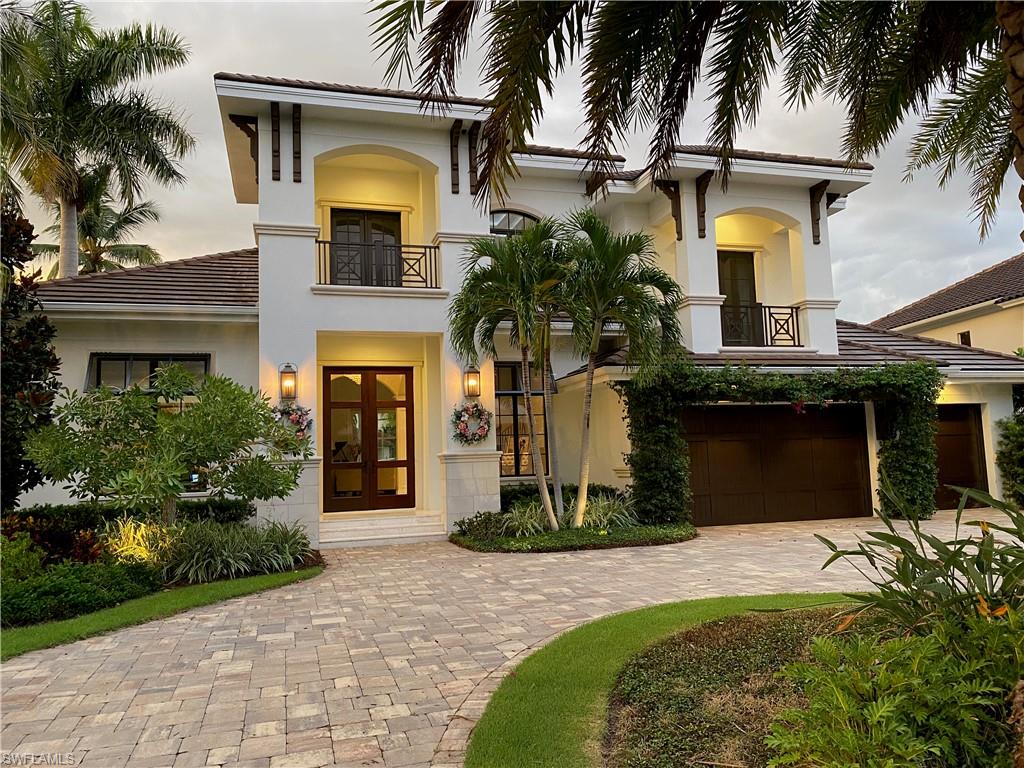 Elegant transitional masterpeice with all the finest amenities.5200 sq ft of perfection on 95 ft waterfront lot with long and wide sunset views.Exceptional quality finishes, windows, doors, and fixtures. Grand entry with 24 ft ceilings in living room and formal dinning. Expansive white kitchen with SubZero/Wolf appliances, ice maker, and wine storage. Spacious family room and informal dinning complement the area. Inviting outdoor great room with fireplace, alfresco kitchen and bar, automated roll down screens overlook premium spa and pool with negative edge and firebowl water features. An 80 ft low profile composite dock and boat lift complete the waterfront. Main floor includes a sumptuous master suit with marble bath, a comfortable den and 1st floor guest suite. A dramatic marble staircase leads upstairs which has a hardwood balcony, two charming guest suites, an entertainment/billard room with wet bar, and large outdoor lanai and sun deck. Deluxe features include a triple garage with circle drive, new seawall, LED lighting indoors and out, audio system throughout, Anderson and PGT impact windows and doors, crystal light fixtures, quartz counters and plantation shutters.