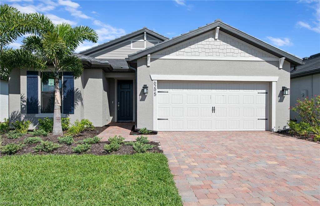 Move to Del Webb - Naples now! This lovely Mystique has a Walk-In Shower in Owner's Bath, Enclosed Flex Room, zero corner Sliding glass door at gathering room, Extended Covered Lanai, Garage Epoxy Floor and much more.