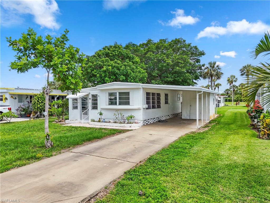 OWN THE LAND! Say goodbye to costly lot rents with this beautifully positioned property in the highly desirable 55+ active adult enclave of Riviera Colony. This is your chance to own a slice of paradise where you hold the deed to the land! 

Step inside this light, bright, and wonderfully maintained residence, offering an open and airy layout designed for easy coastal living. Boasting three spacious bedrooms and a functional layout, the unit feels incredibly welcoming the moment you walk through the door. The heart of the home seamlessly connects your living spaces, perfect for relaxing after a day at the beach or hosting neighbors for a casual get-together. Outside, the property shines with a fantastic carport providing covered, protected parking and an expansive yard space that offers a true sense of privacy and room to enjoy the gorgeous Florida sunshine. It is the ultimate low-maintenance, high-comfort retreat! 
Nestled in a vibrant, friendly community packed with resort-style perks—including a sparkling pool, lively clubhouse, shuffleboard, and bocce—you will instantly feel right at home. Riviera Colony offers the perfect blend of a relaxed neighborhood feel with unbeatable access to the absolute best of Southwest Florida.

Location is everything, and this home places you minutes from the crown jewels of Naples! Cruise down just 6 miles to experience the world-renowned Downtown Naples Beaches and the luxury dining and shopping of iconic 5th Avenue South. Craving a casual, local vibe? You are just a stone's throw from the eclectic Bayshore Arts District, the waterfront dining and shopping at Tin City, and the high-energy, food-truck paradise of Celebration Park. Enjoy ultimate coastal convenience, vibrant nightlife, and a relaxed Florida lifestyle all in one perfect package. Schedule your tour today and start living your Naples dream!