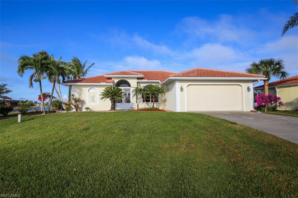 You will fall in love with this pristine LAKEFRONT POOL HOME located in beautiful Burnt Store Lakes. With a water view from every room and a pool and lanai touting western exposure promising glorious sunsets what’s not to love! This 2 Bedroom, 2.5 Bathroom, 2 Car Garage home offers a split bedroom floor plan, open great room and dining area, a family room that could serve as a 3rd bedroom, eat-in kitchen. The bright kitchen features white raised panel cabinets, black stainless appliances, breakfast bar, pantry closet, engineered cherry wood floors and its own dinette area overlooking the pool and lake. The Master bedroom suite features a walk in closet, dual sinks, jetted tub and separate walk in shower. Your living space extends to the screened lanai and pool area with a newly resurfaced heated swimming pool, cool deck, outdoor shower and pool bath. Burnt Store Lakes boasts 11 lakes, community park and kayak launch accessing Charlotte Harbor. At Burnt Store Lakes residents enjoy fishing, bird watching and observing abundant wildlife. Located adjacent to Burnt Store Marina you can also enjoy harbor access boating, golf, activity center, fitness center and onsite dining.