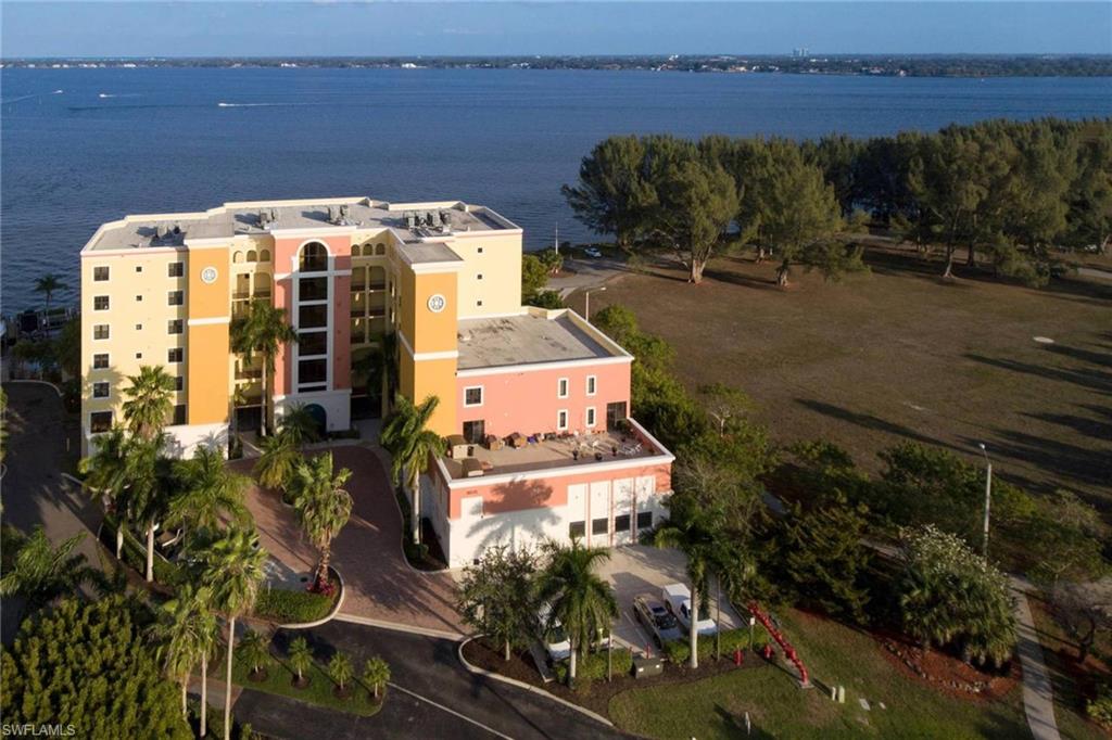 UNBELIEVABLE RIVER AND PARK VIEWS!  Major Price Reduction! This beautiful unit was a former model and can be purchased furnished. It is the best priced unit available in the building!!! Live your dream life, and enjoy watching the boats and dolphins out the lanai, while enjoying the music and activities at the park.  The location is close to downtown Fort Myers, and convenient to Sanibel and Fort Myers Beach.  The flooring is all tile with the exception of the bedrooms. The windows are all hurricane rated so no need to worry about getting shutters up. Step outside for a stroll in the park or a swim in the heated pool. The amenities include a community club room, exercise room, separate air-conditioned storage units, secured garage parking and the life style that we all dream about!!  This unit is elegant and will not disappoint!!  Please checkout the virtual tour!!  Furnishings Negotiable!  New water heater in 2017.  New air conditioner in 2018!